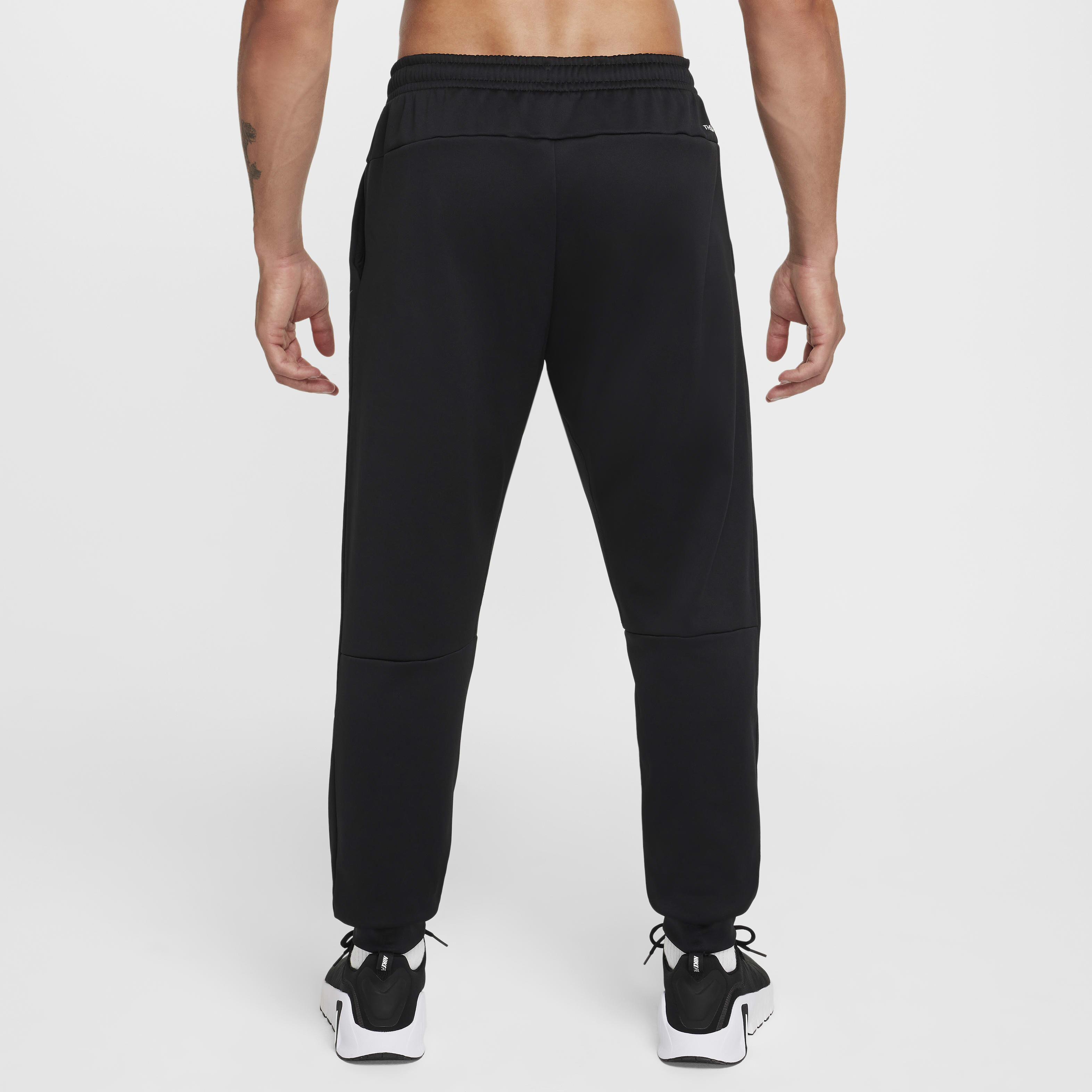 Buy Nike Men's Therma-FIT Tapered Fitness Trousers - Black