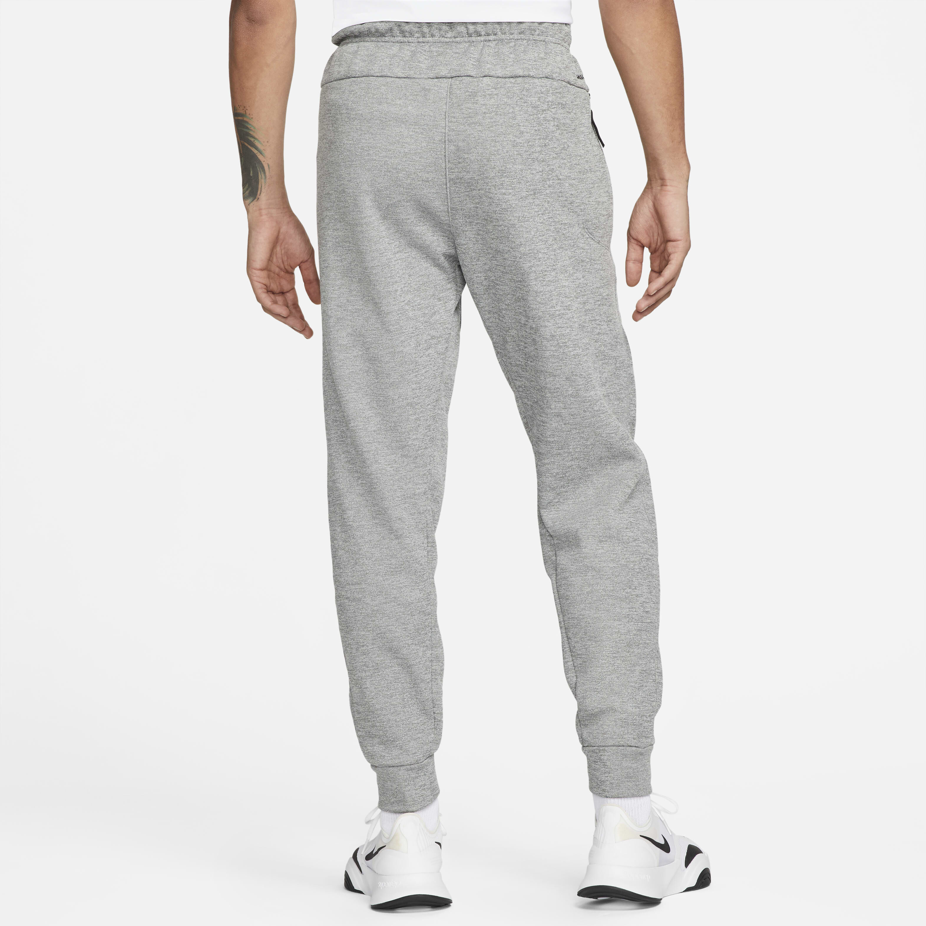 Buy Nike Therma Men s Therma FIT Tapered Fitness Trousers Dark Grey Heather Particle Grey Black Nike Kuwait Official