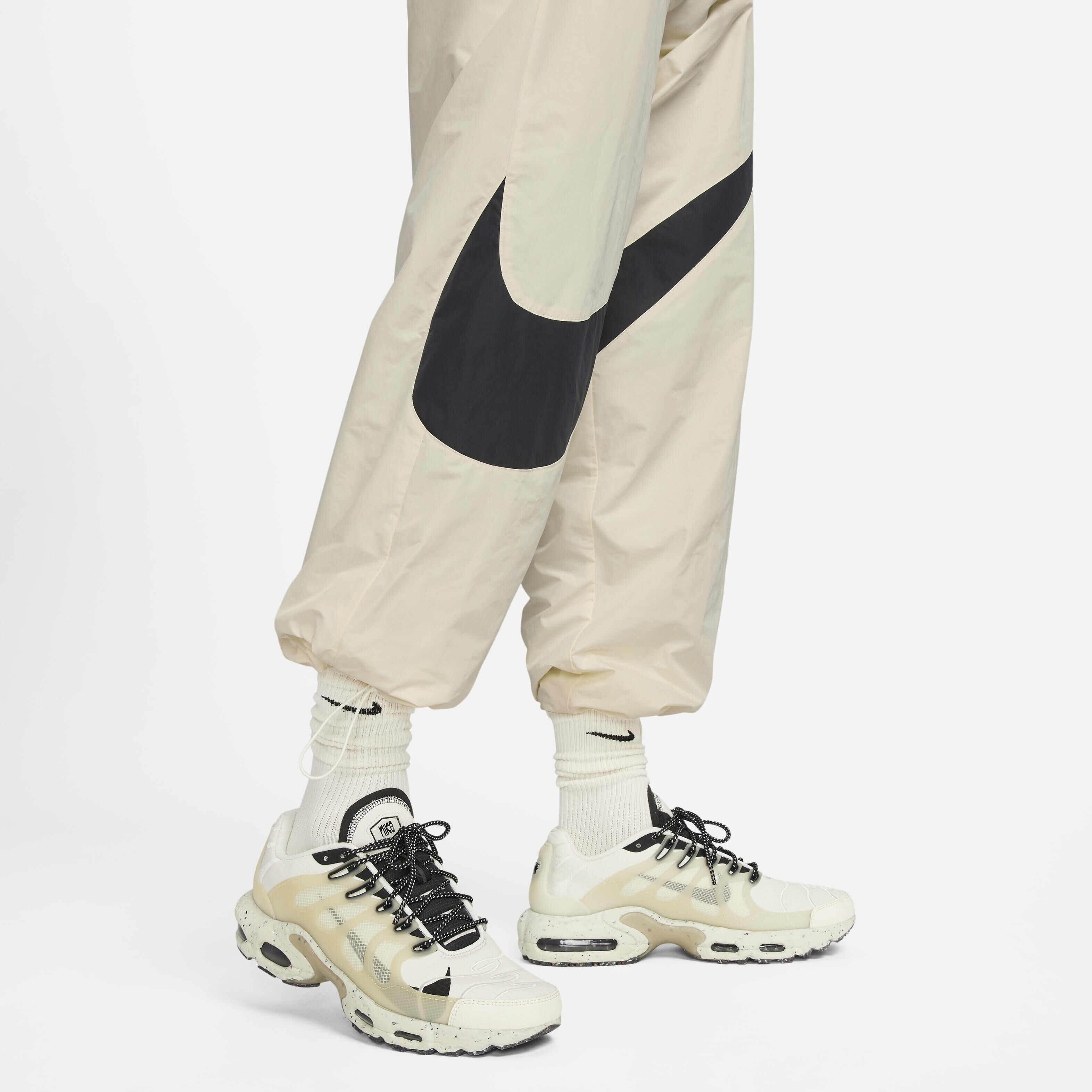 Nike swoosh woven pant top