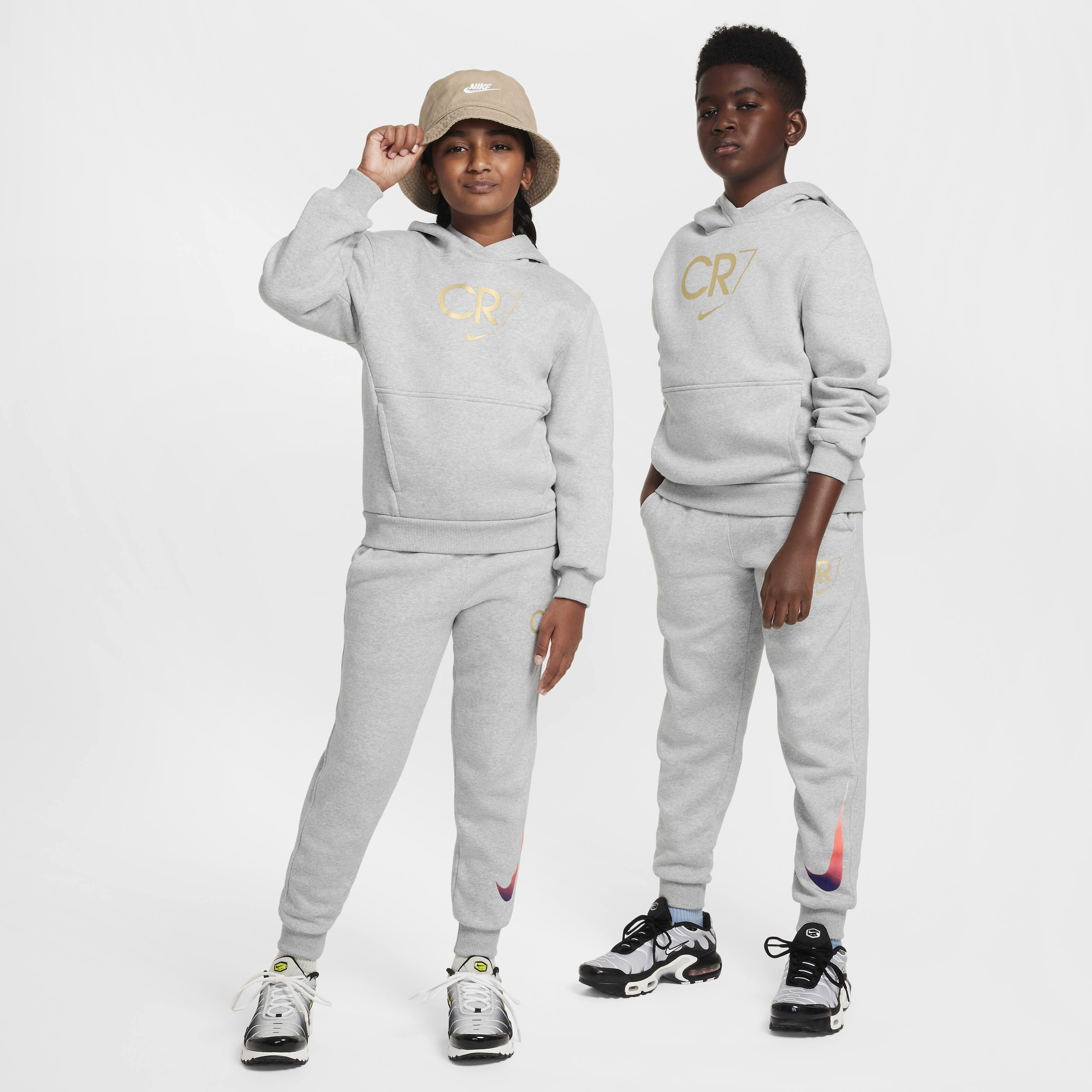 Buy CR7 Club Fleece Older Kids Football Hoodie Light Smoke Grey Heather Metallic Gold Nike Kuwait Official