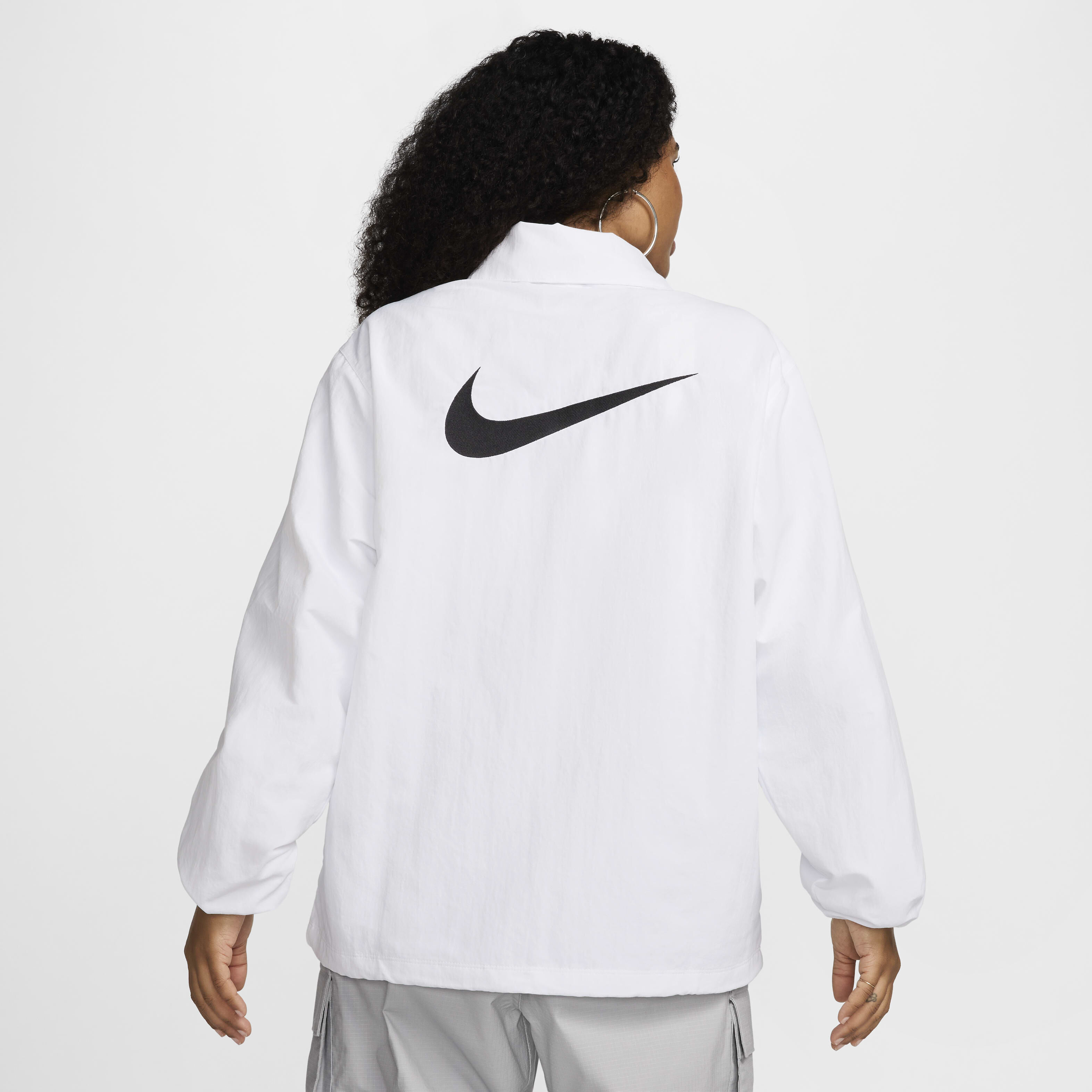 Buy Nike Sportswear Essential Women s Oversized UV Woven Coaches Jacket Nike Kuwait Official