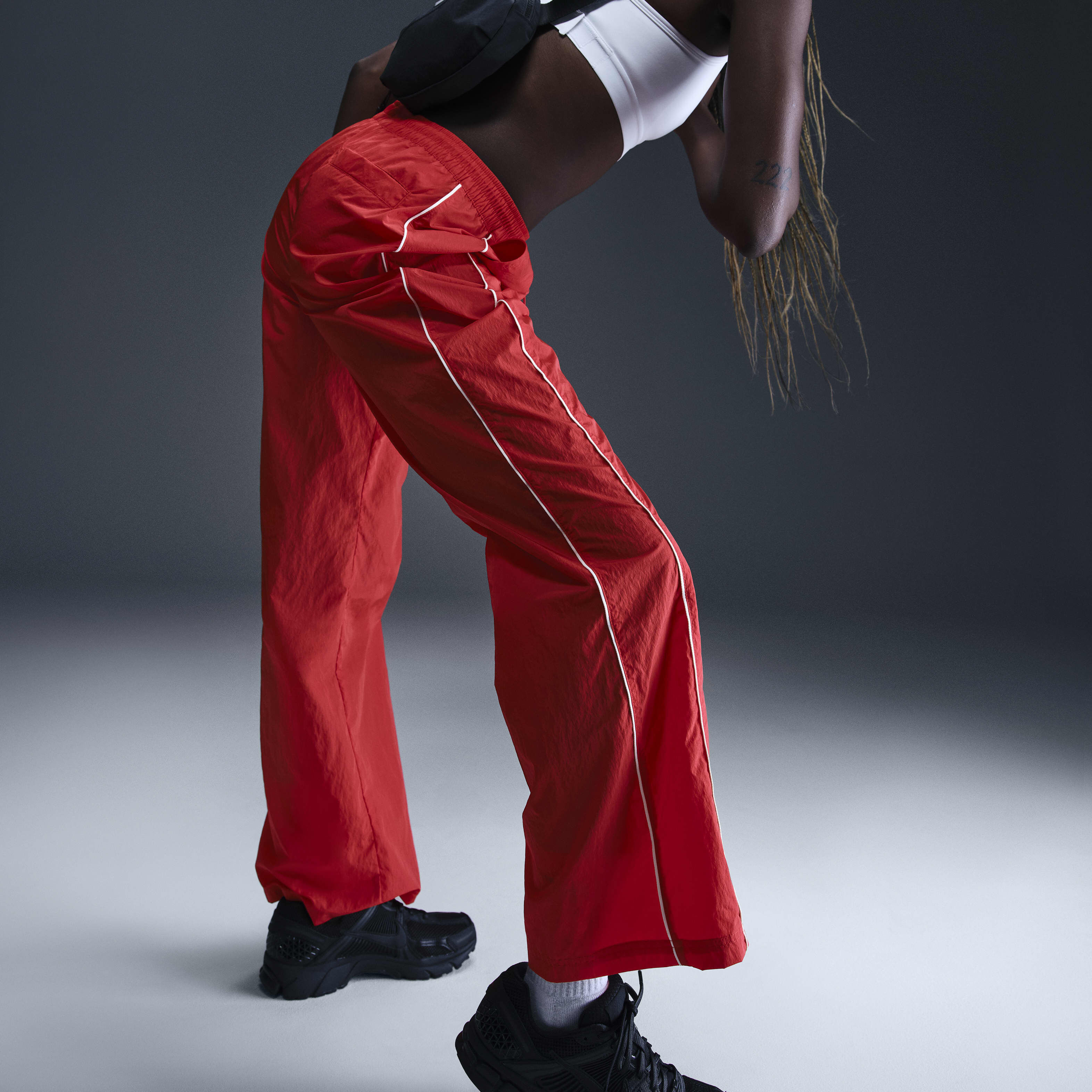 Buy Nike Windrunner Women s High Waisted Woven Open Hem Trousers Nike Kuwait Official