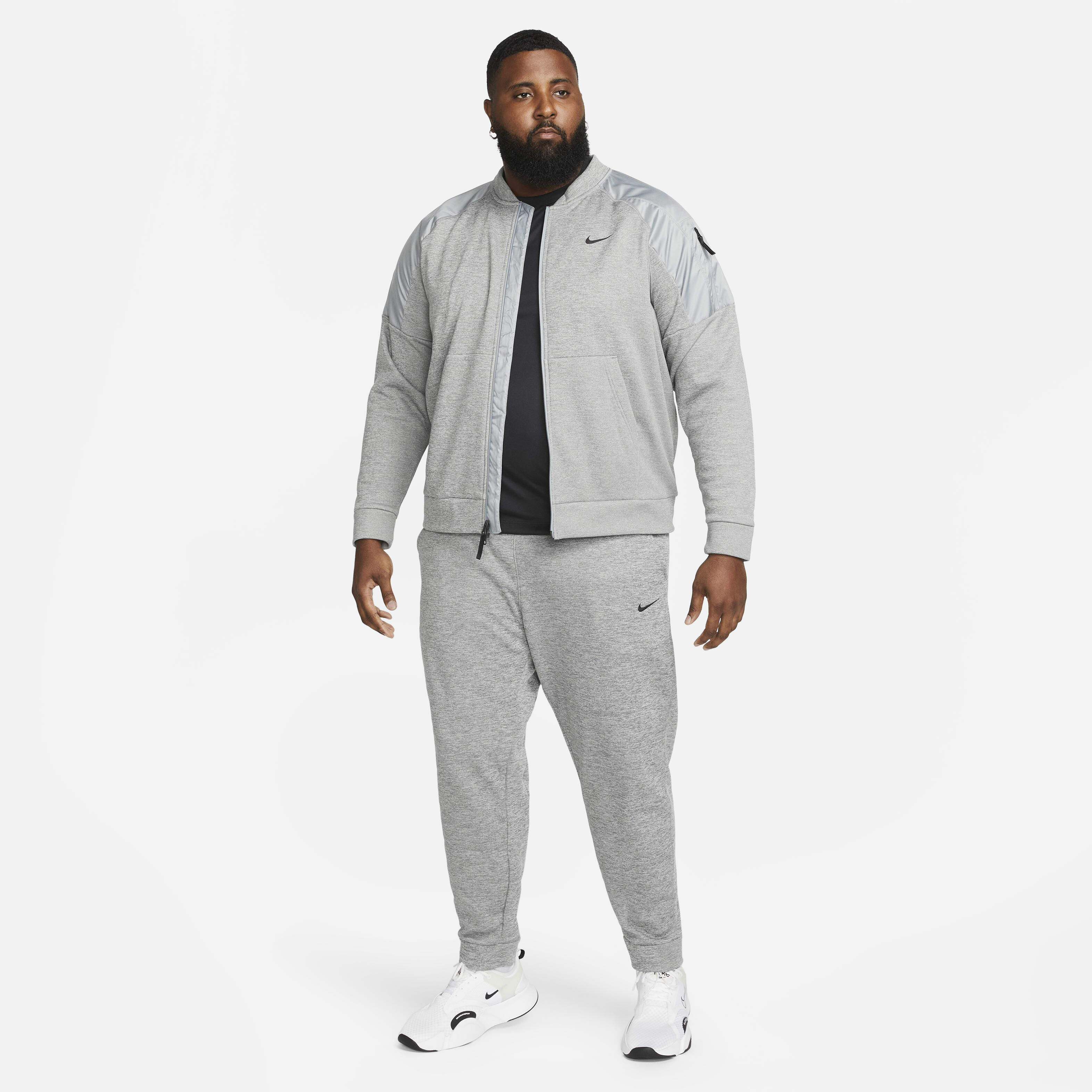 Buy Nike Therma Men s Therma FIT Tapered Fitness Trousers Dark Grey Heather Particle Grey Black Nike Kuwait Official
