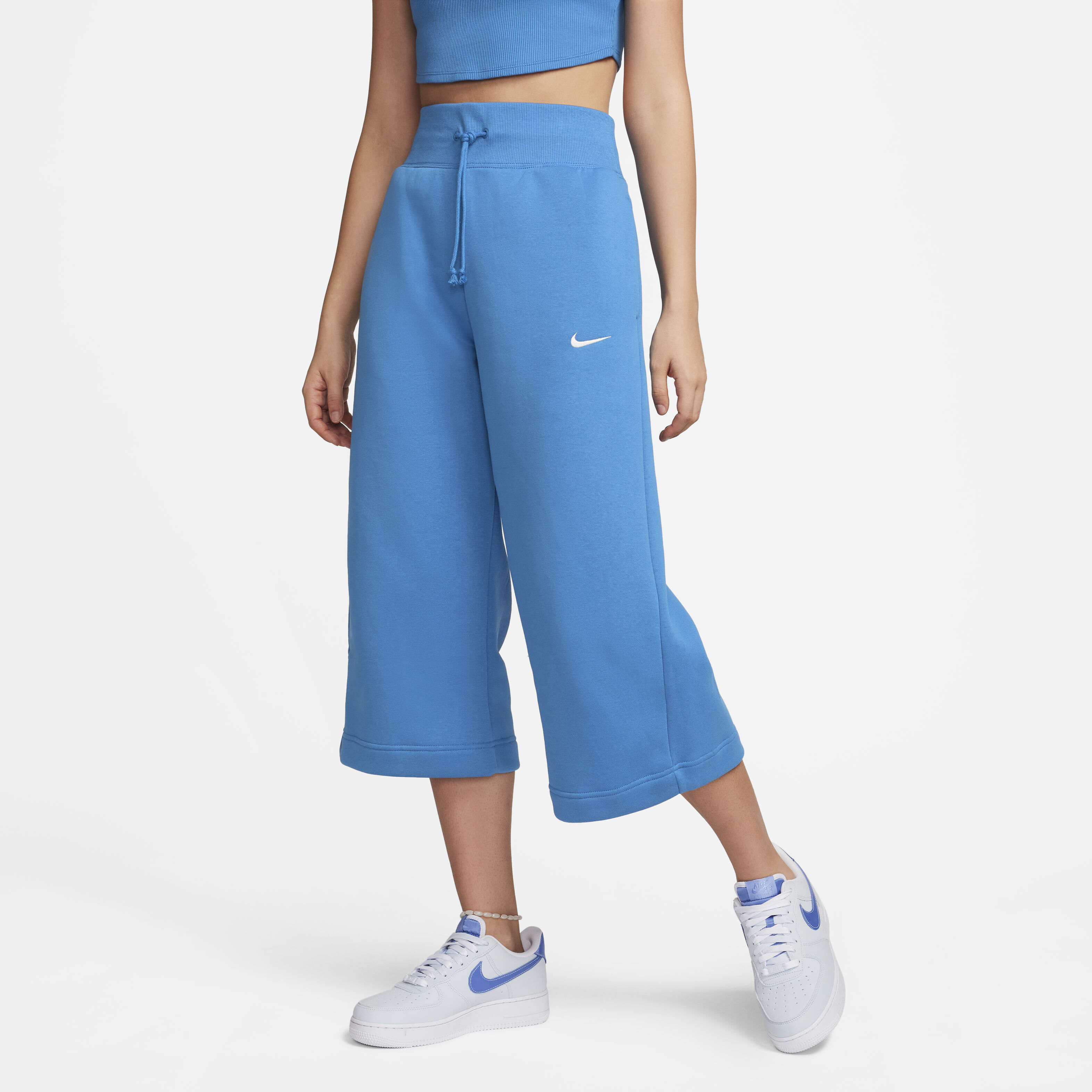 Buy Nike Sportswear Phoenix Fleece Women s High Waisted Cropped Tracksuit Bottoms Star Blue Sail Nike Kuwait Official