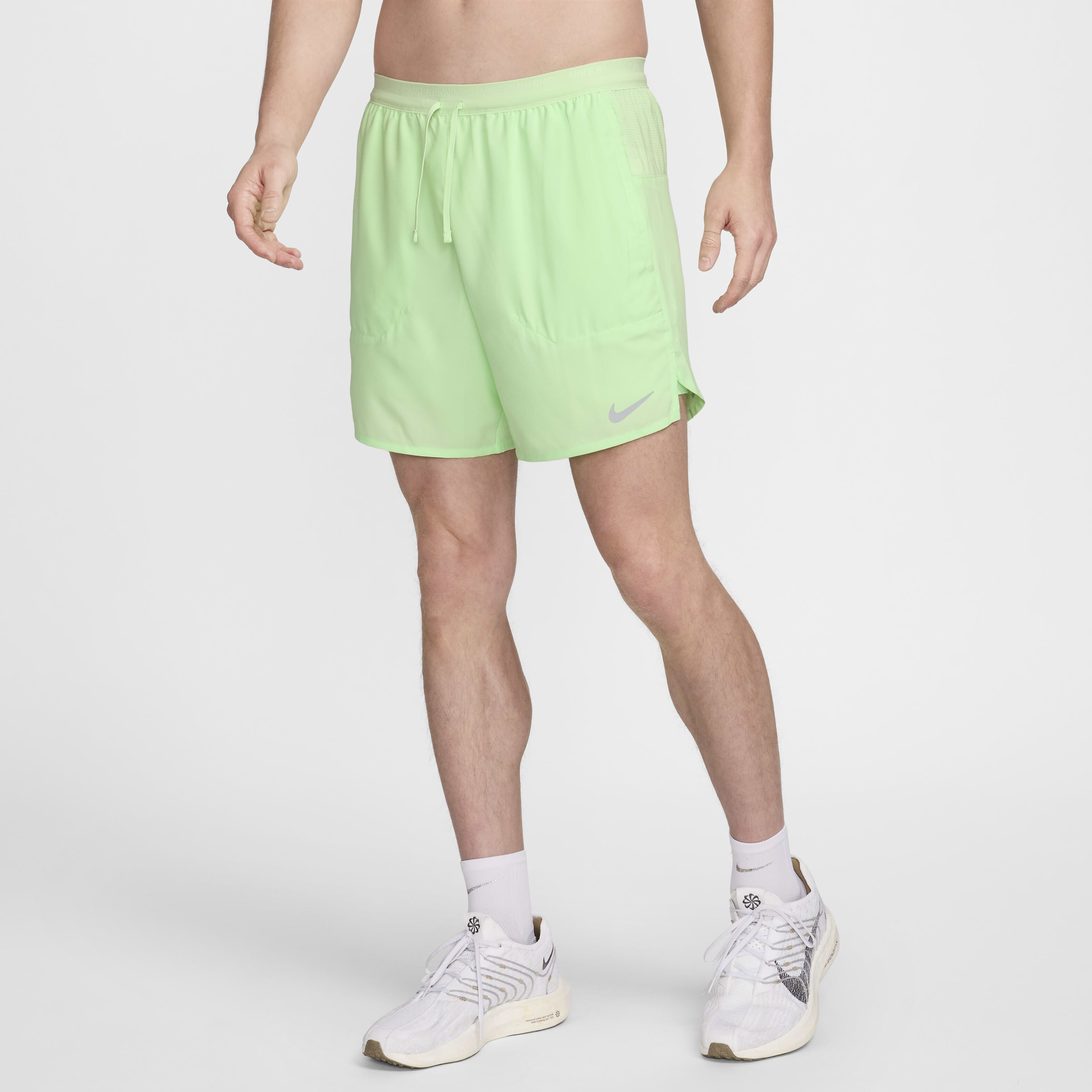 Buy Nike Stride Men s Dri FIT 18cm approx. 2 in 1 Running Shorts Vapour Green Vapour Green Vapour Green Nike Kuwait Official