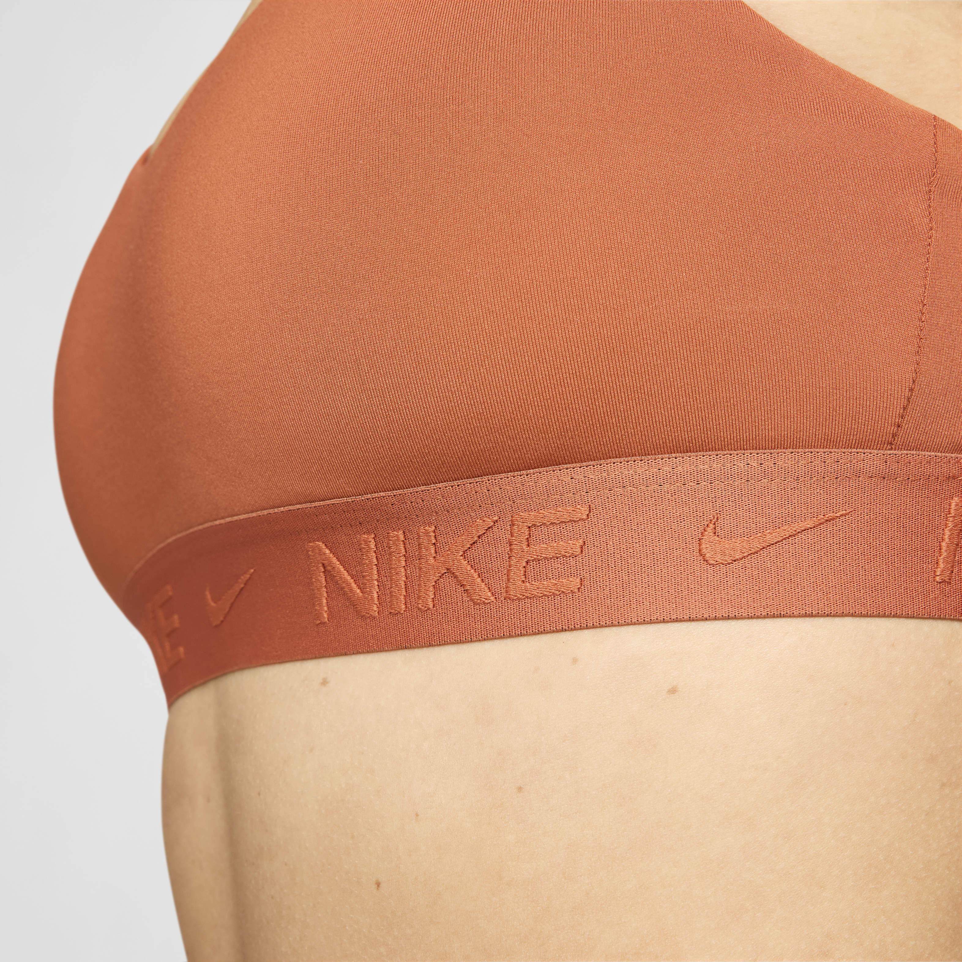 Buy Nike Indy Light Support Women s Padded Adjustable Sports Bra Burnt Sunrise Burnt Sunrise Nike Kuwait Official