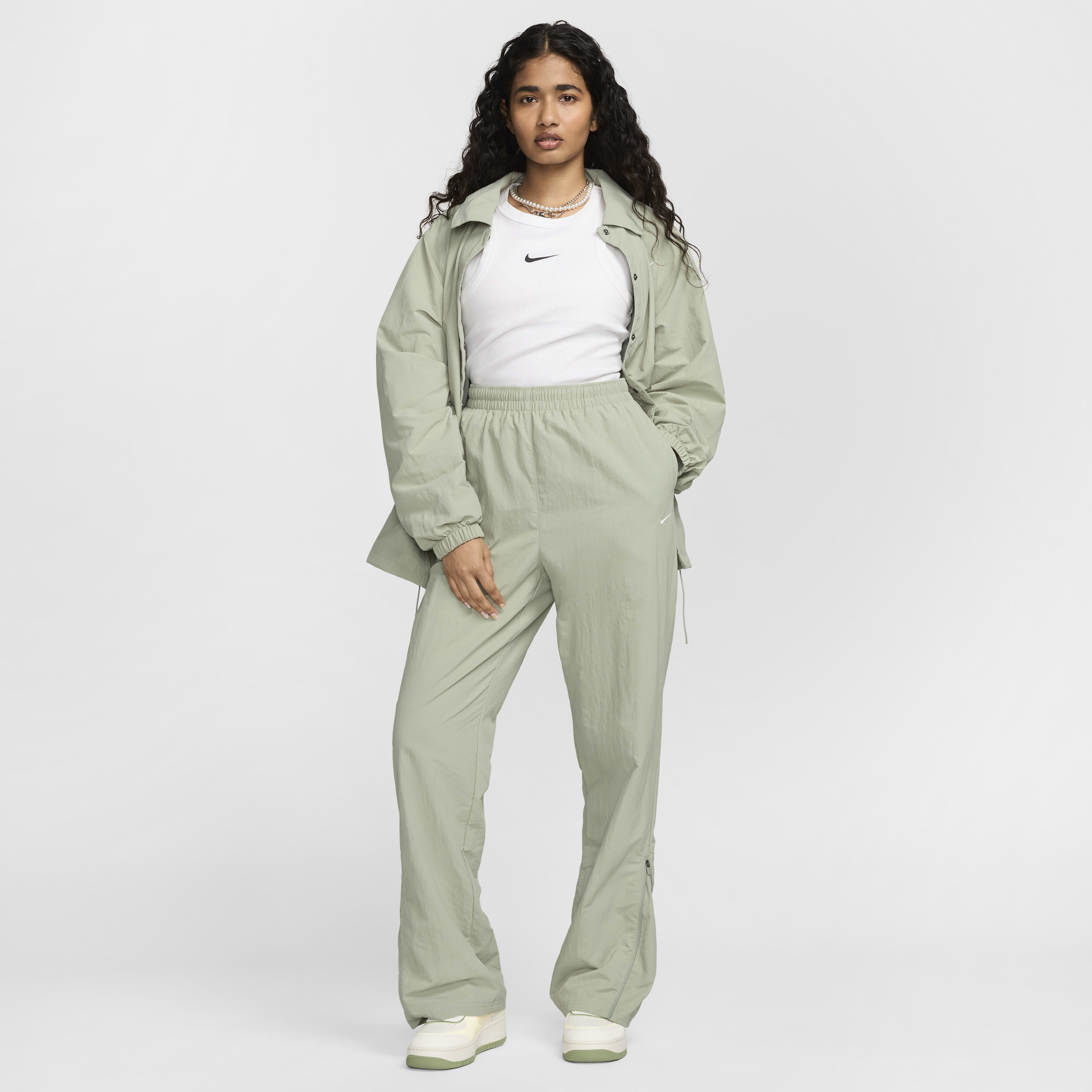 Buy Nike Sportswear Essential Women s Oversized UV Woven Coaches Jacket Jade Horizon Sail Nike Kuwait Official