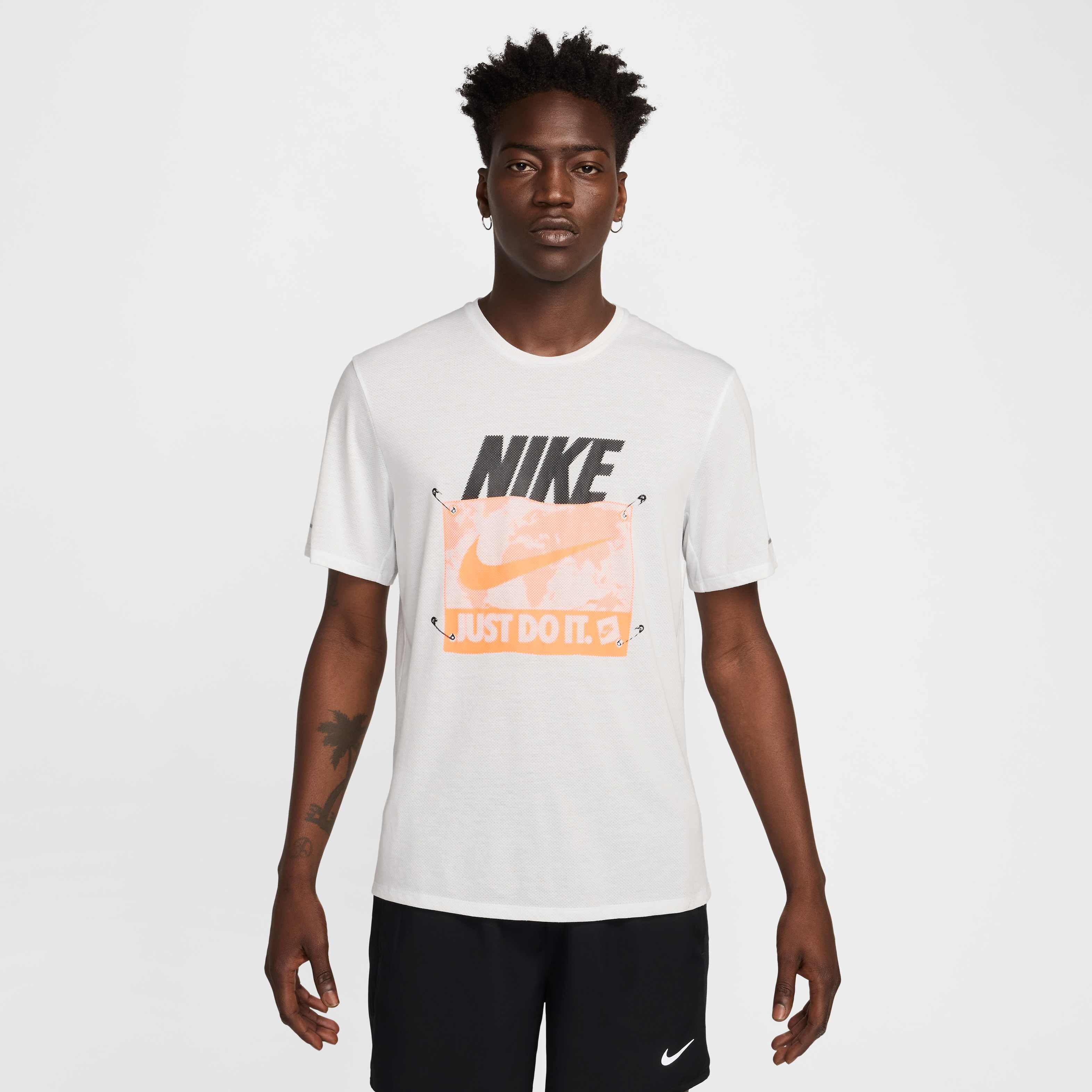 white black and orange nike shirt