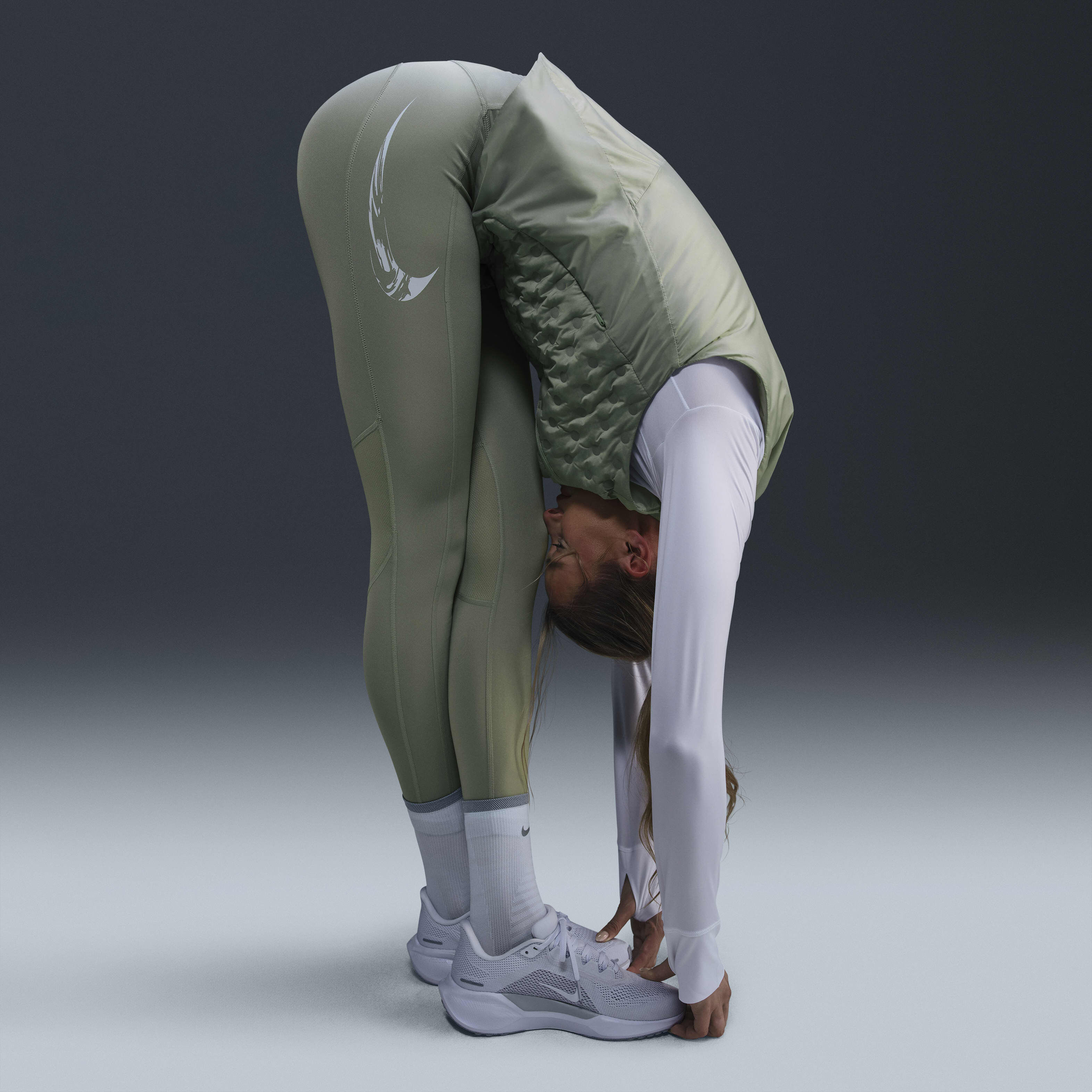 Buy Nike Fast Women s Mid Rise 7 8 Running Leggings with Pockets Jade Horizon Light Silver Nike Kuwait Official