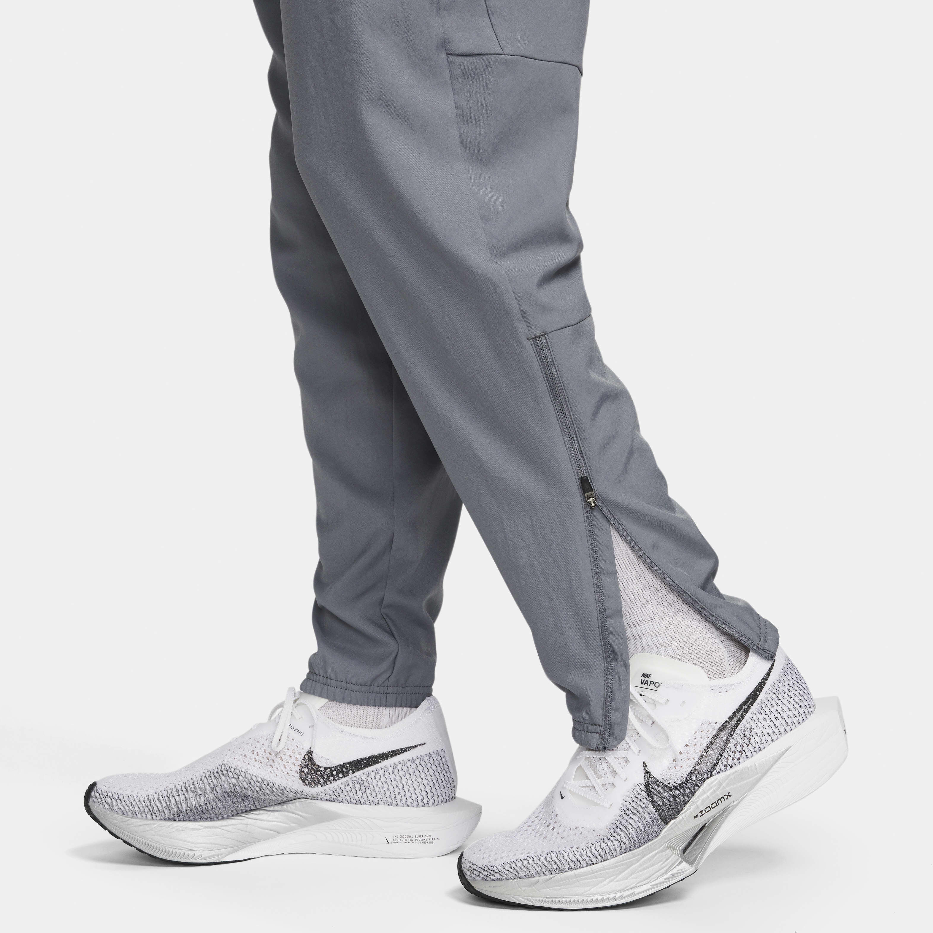 Nike essential woven track pants shop