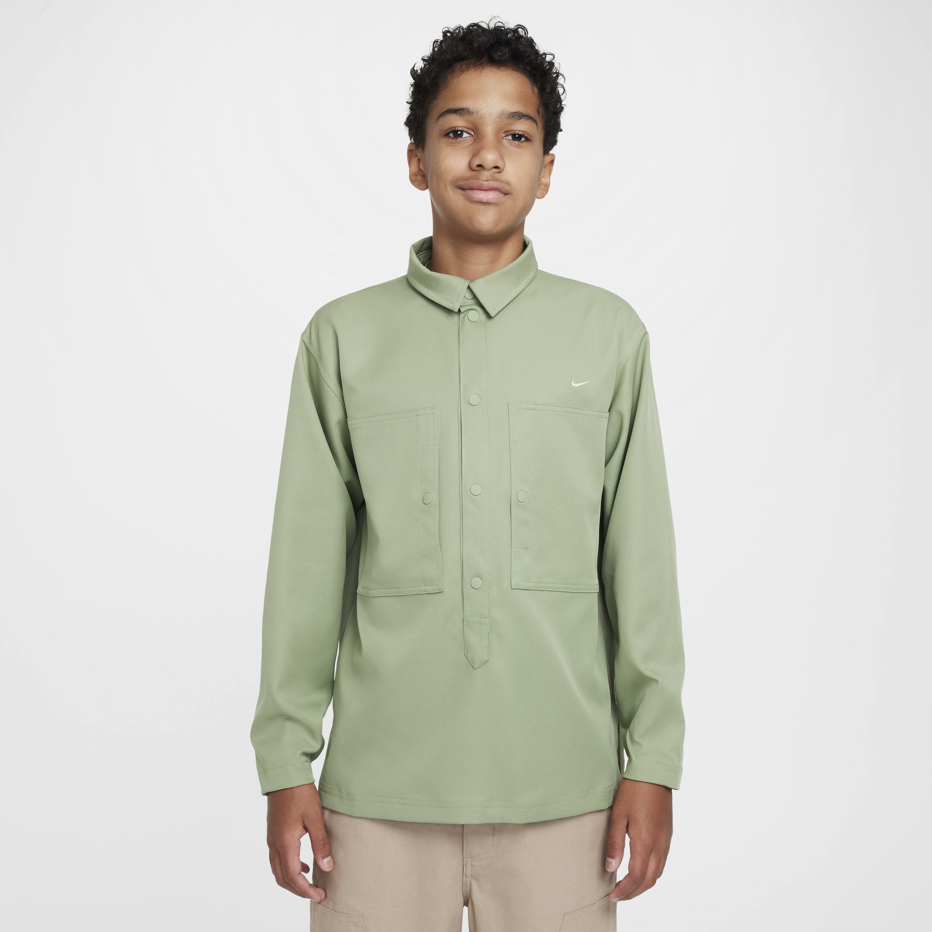 Buy Nike Sportswear Metro Ground Older Kids' Top - Oil Green/Olive Aura |  Nike Kuwait Official