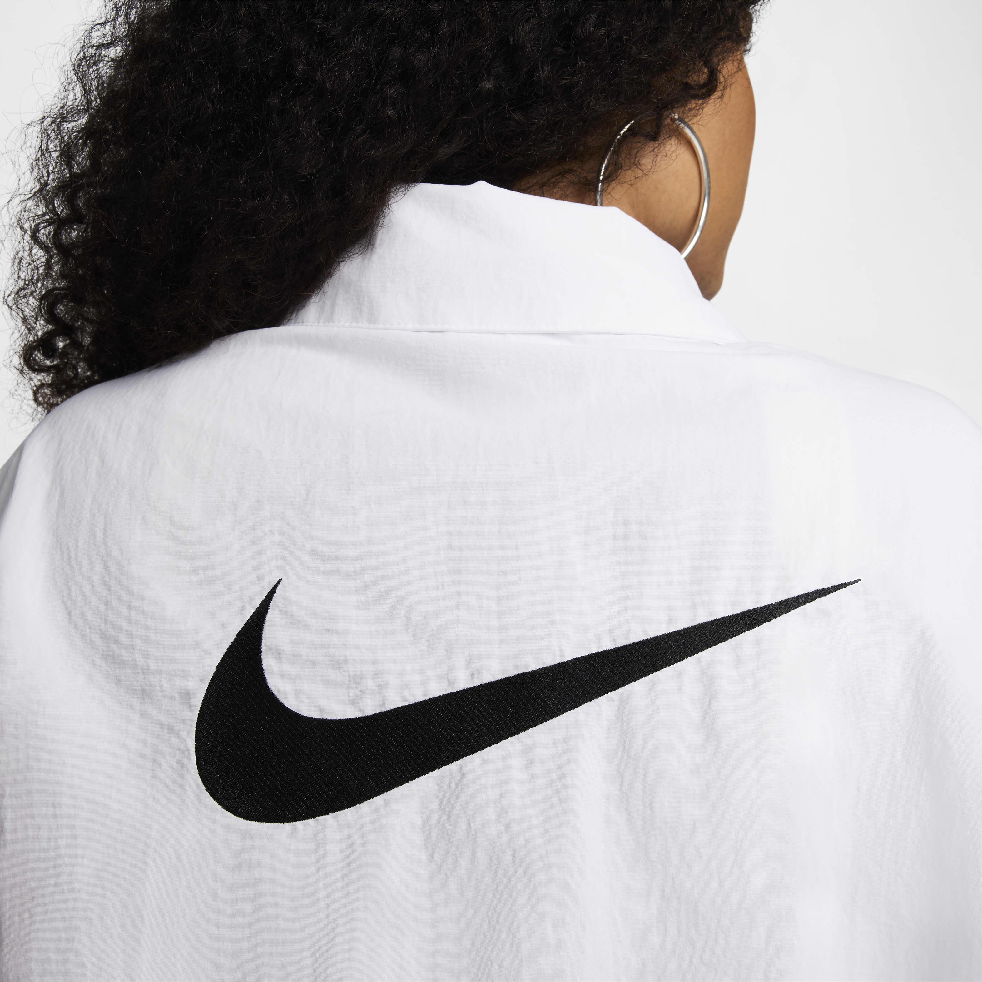 Buy Nike Sportswear Essential Women s Oversized UV Woven Coaches Jacket Nike Kuwait Official