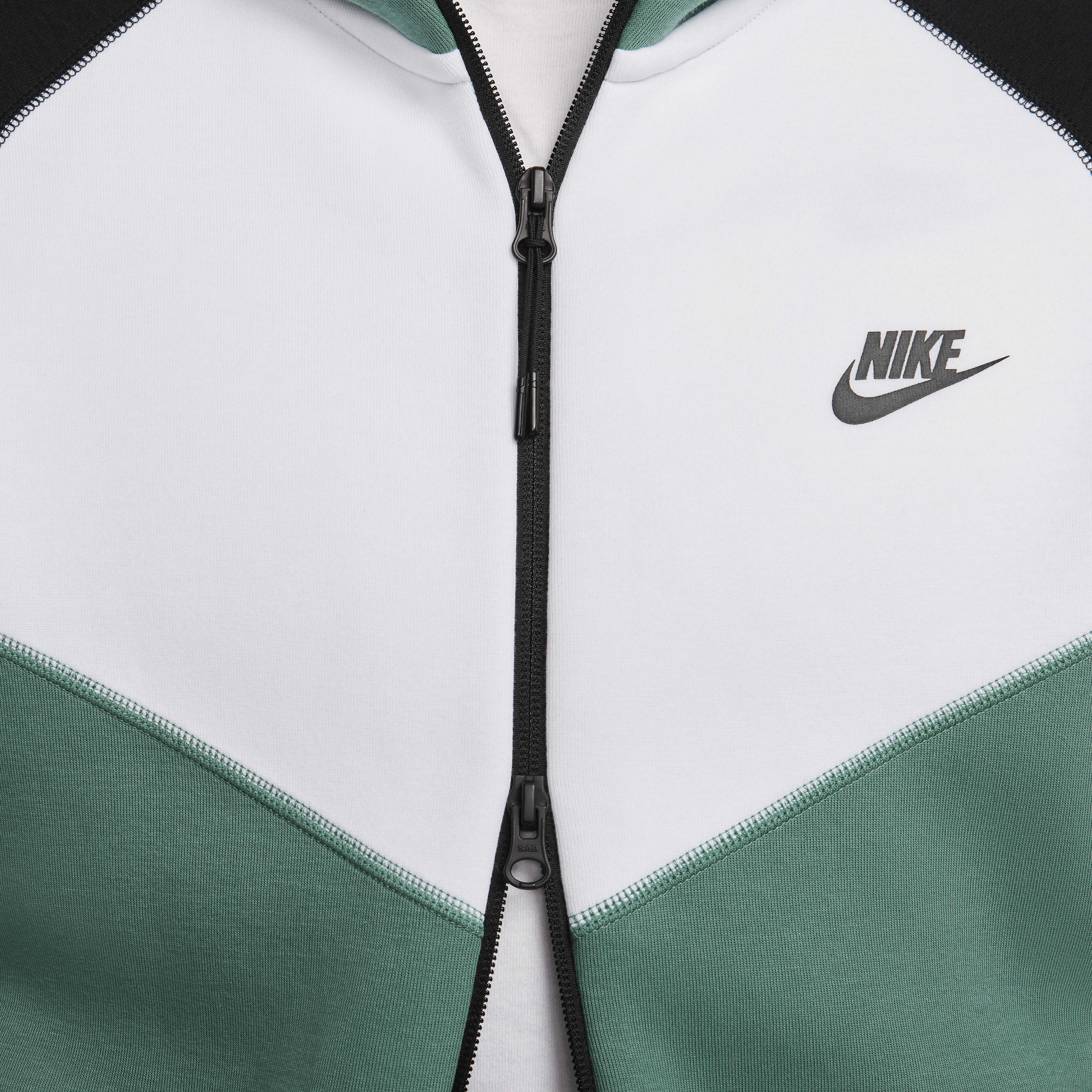 white and green nike tech fleece