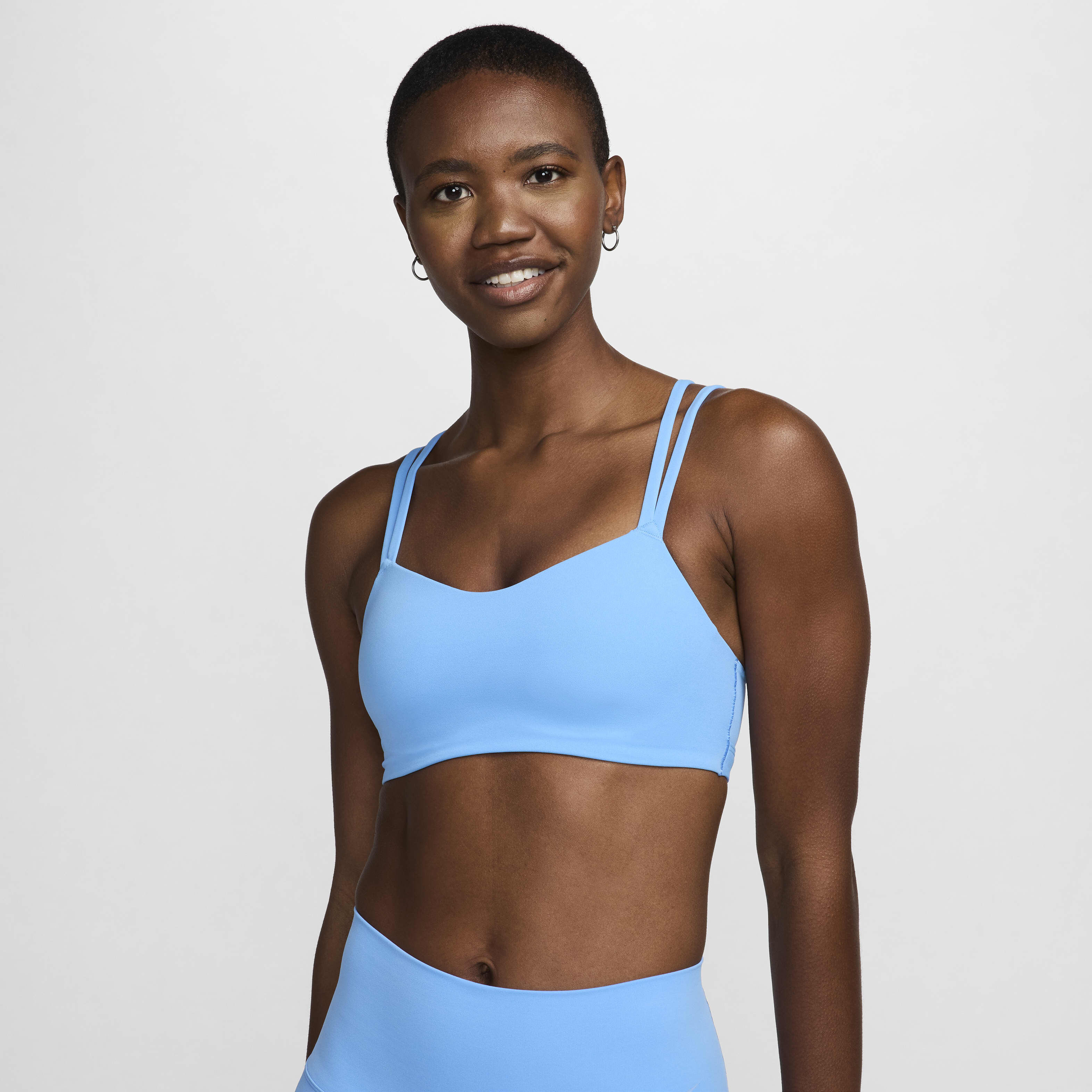 Buy Nike Zenvy Strappy Women s Light Support Padded Sports Bra University Blue White Nike Kuwait Official