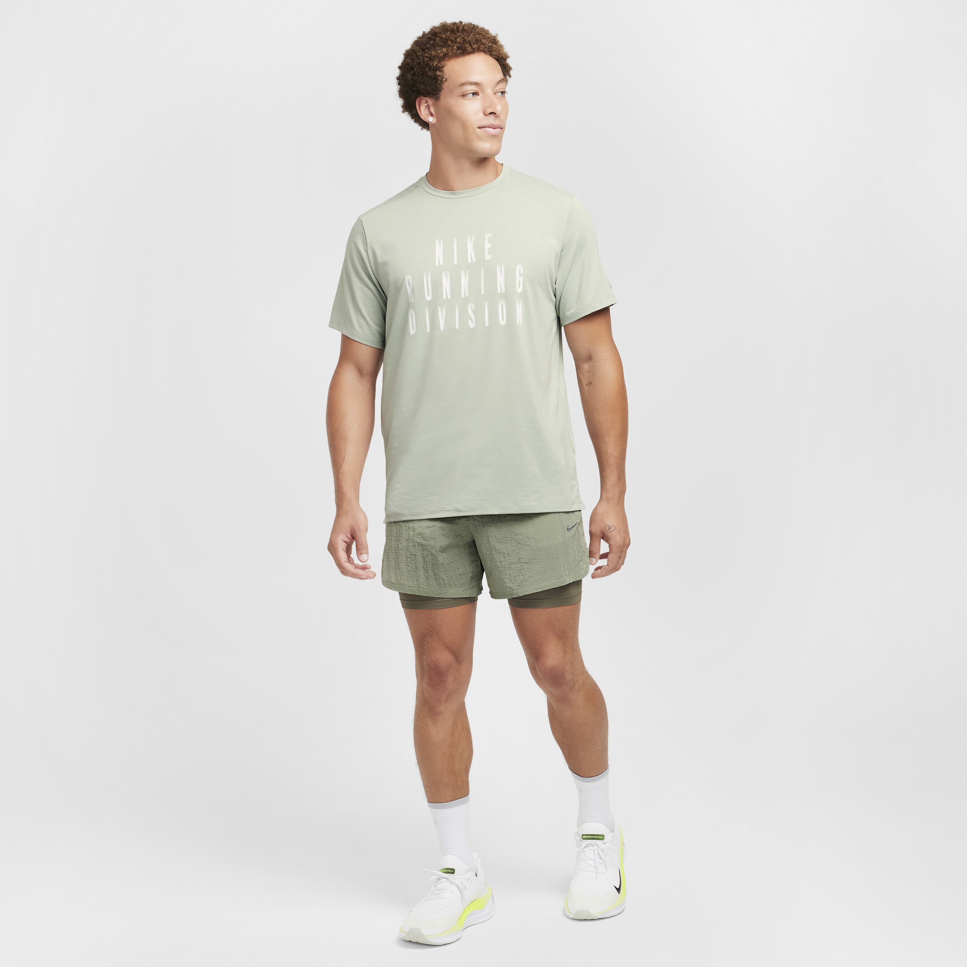 Buy Nike Rise 365 Running Division Men s Dri FIT Short Sleeve Running Top Jade Horizon Photon Dust Nike Kuwait Official
