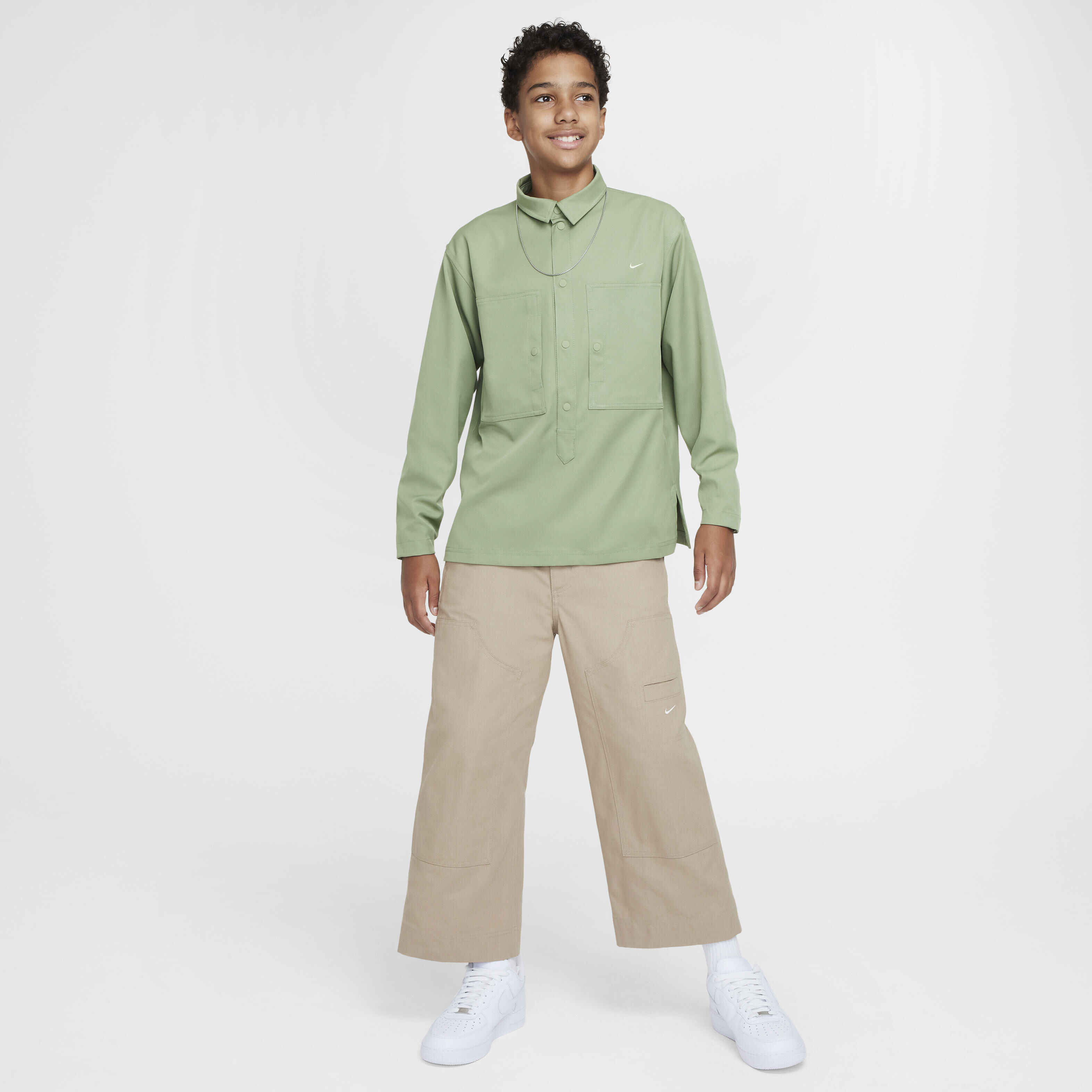 Buy Nike Sportswear Metro Ground Older Kids' Top - Oil Green/Olive Aura |  Nike Kuwait Official