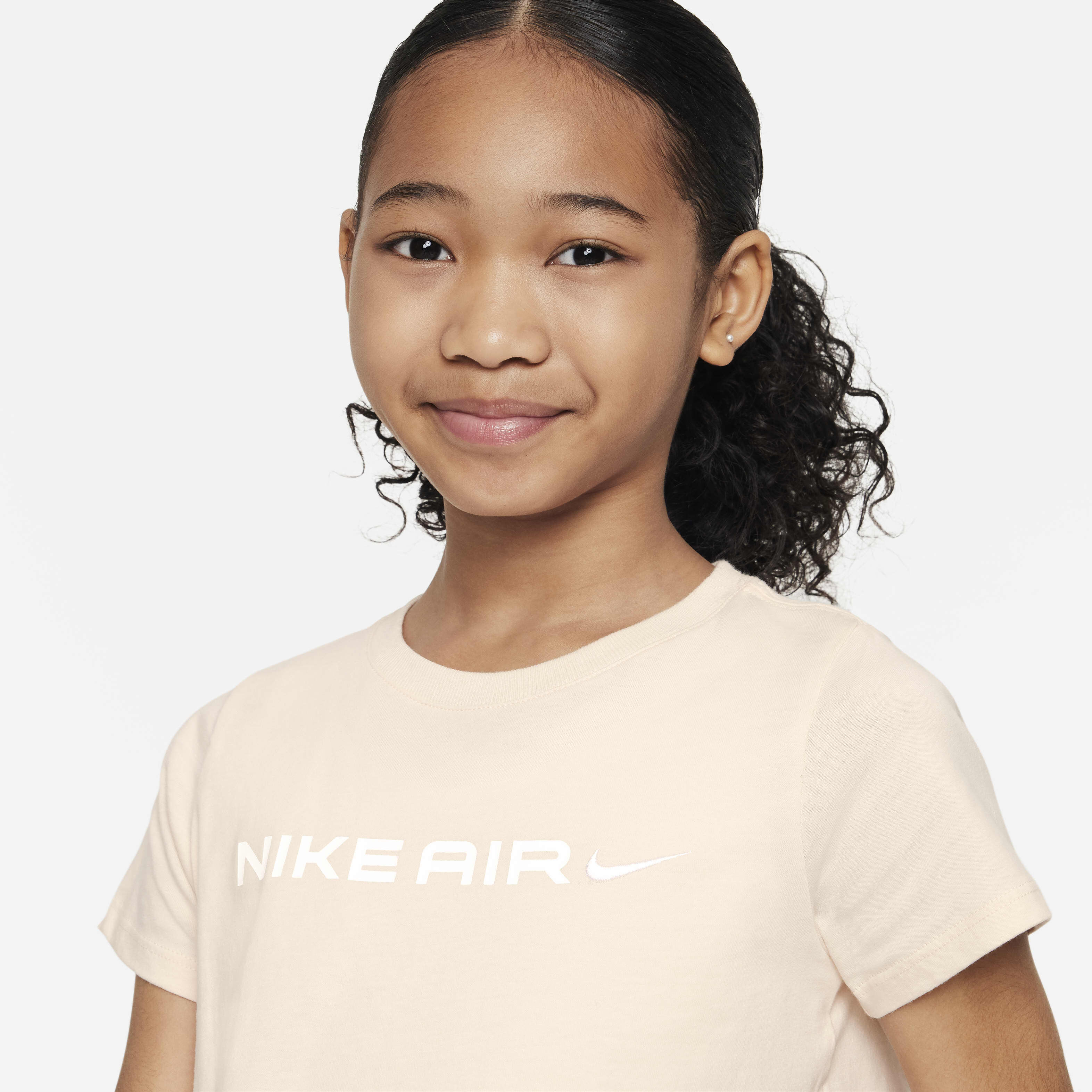 Buy Nike Air Older Kids' (Girls') T-Shirt - Guava Ice | Nike