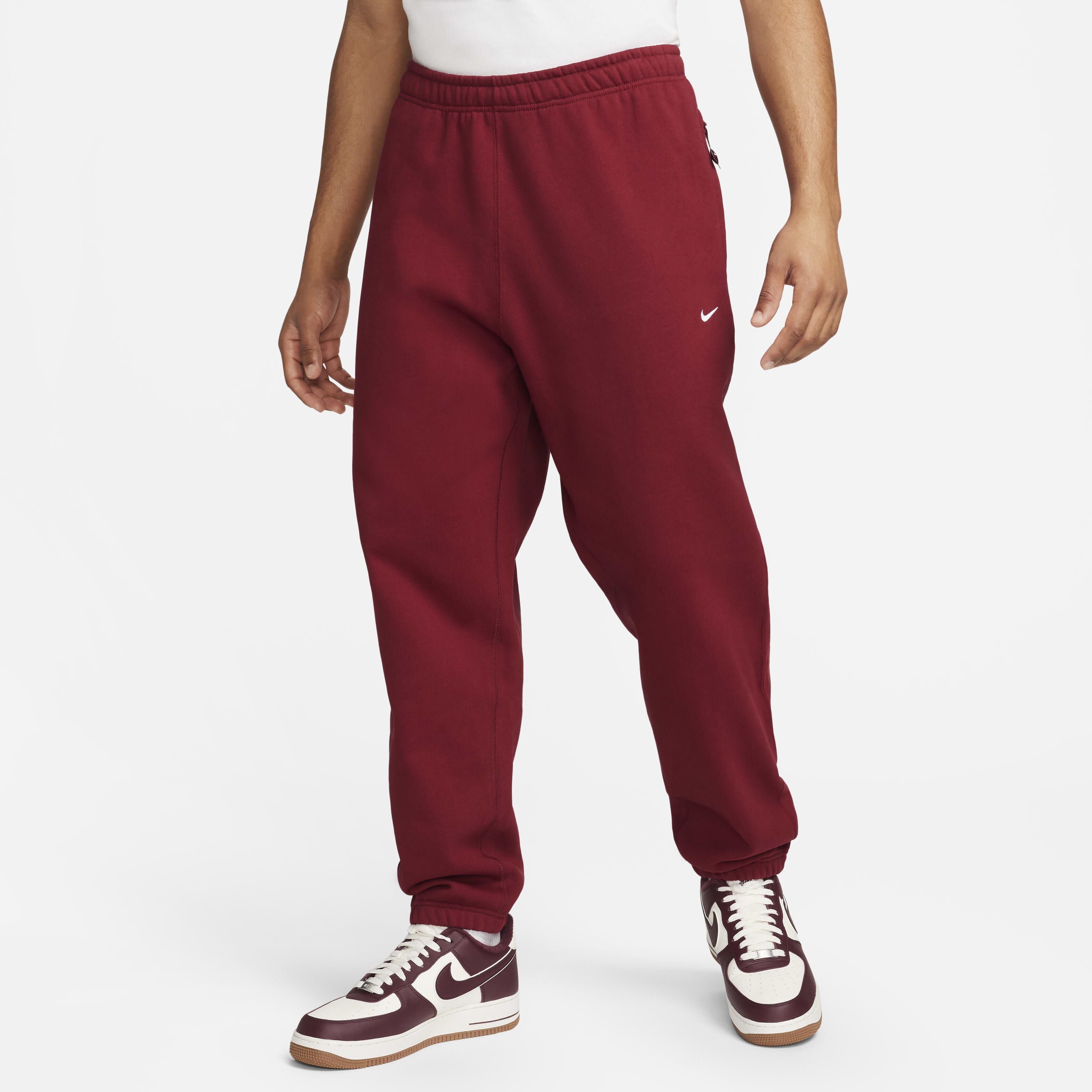 red and white nike pants