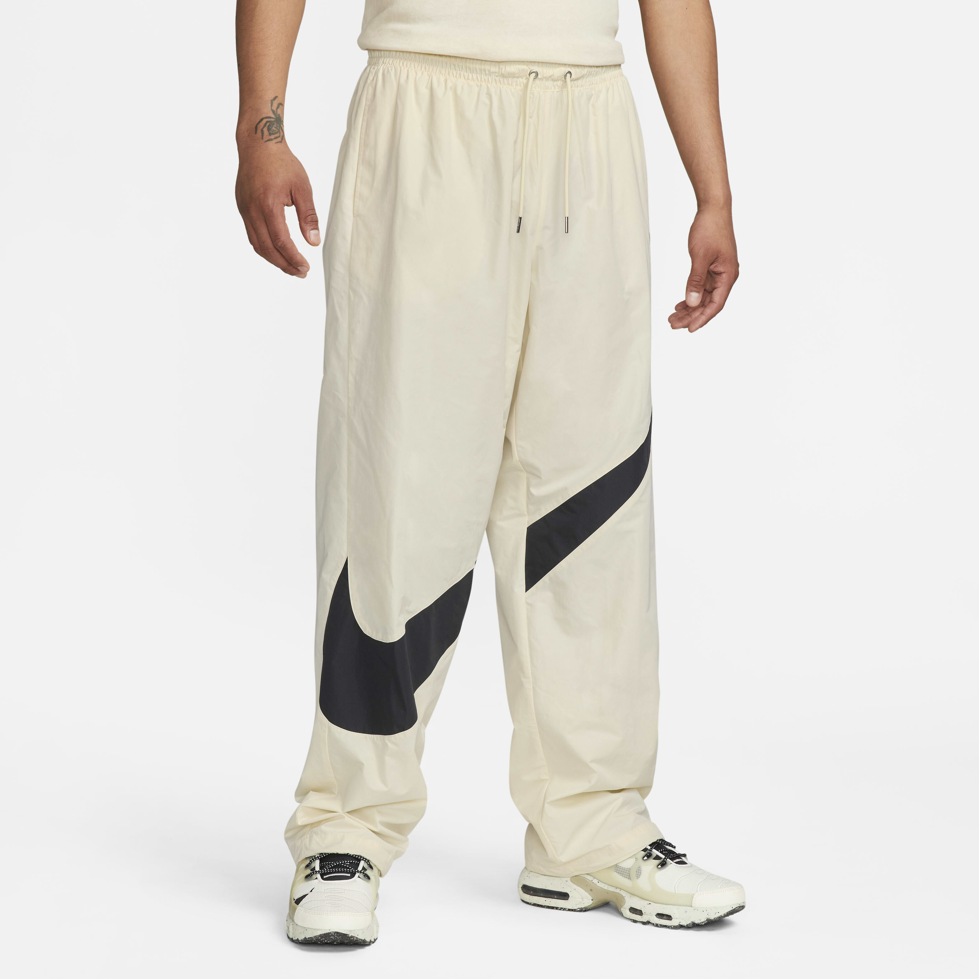 Buy Nike Swoosh Men s Woven Trousers Coconut Milk Black Coconut Milk Nike Kuwait Official
