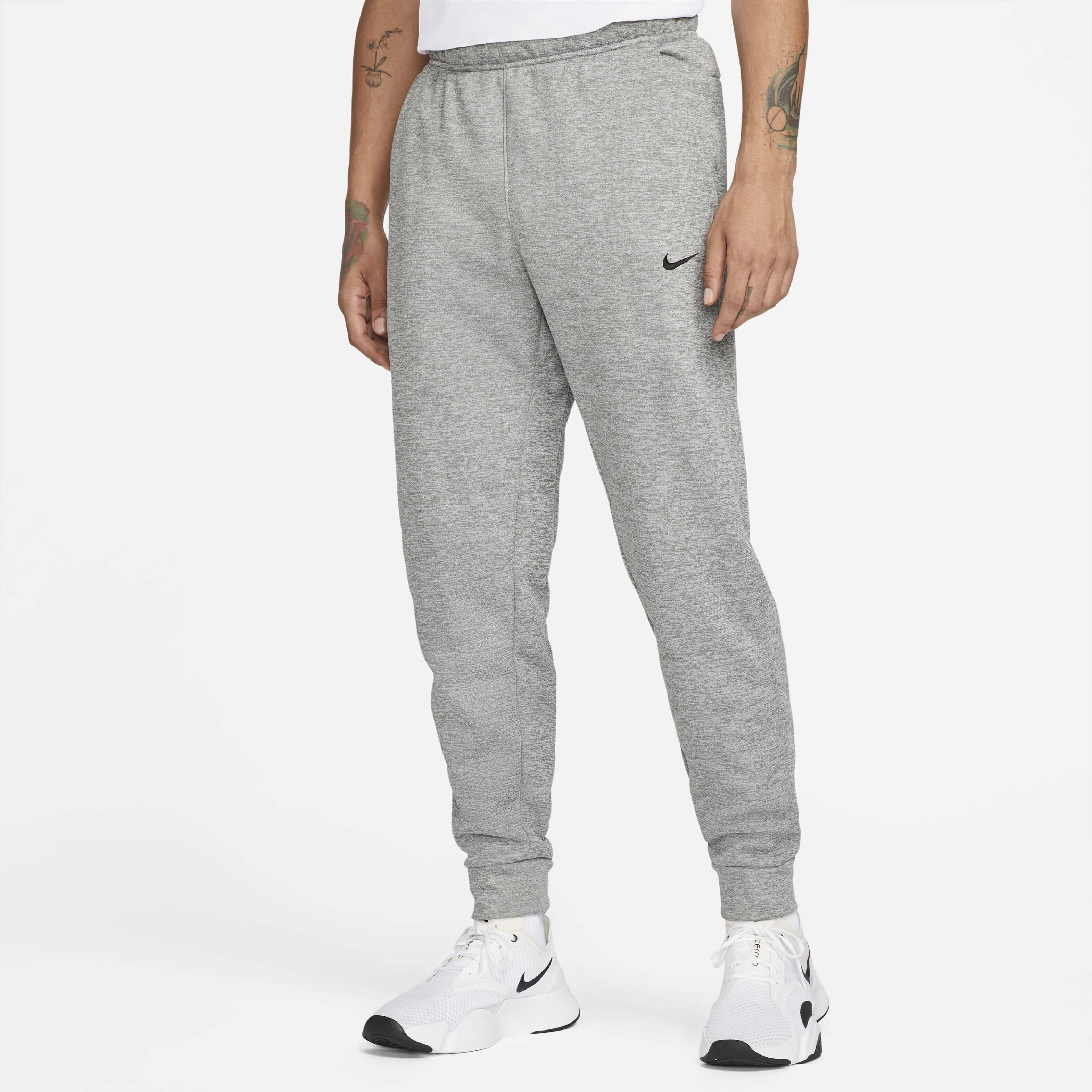 Buy Nike Therma Men s Therma FIT Tapered Fitness Trousers Dark Grey Heather Particle Grey Black Nike Kuwait Official