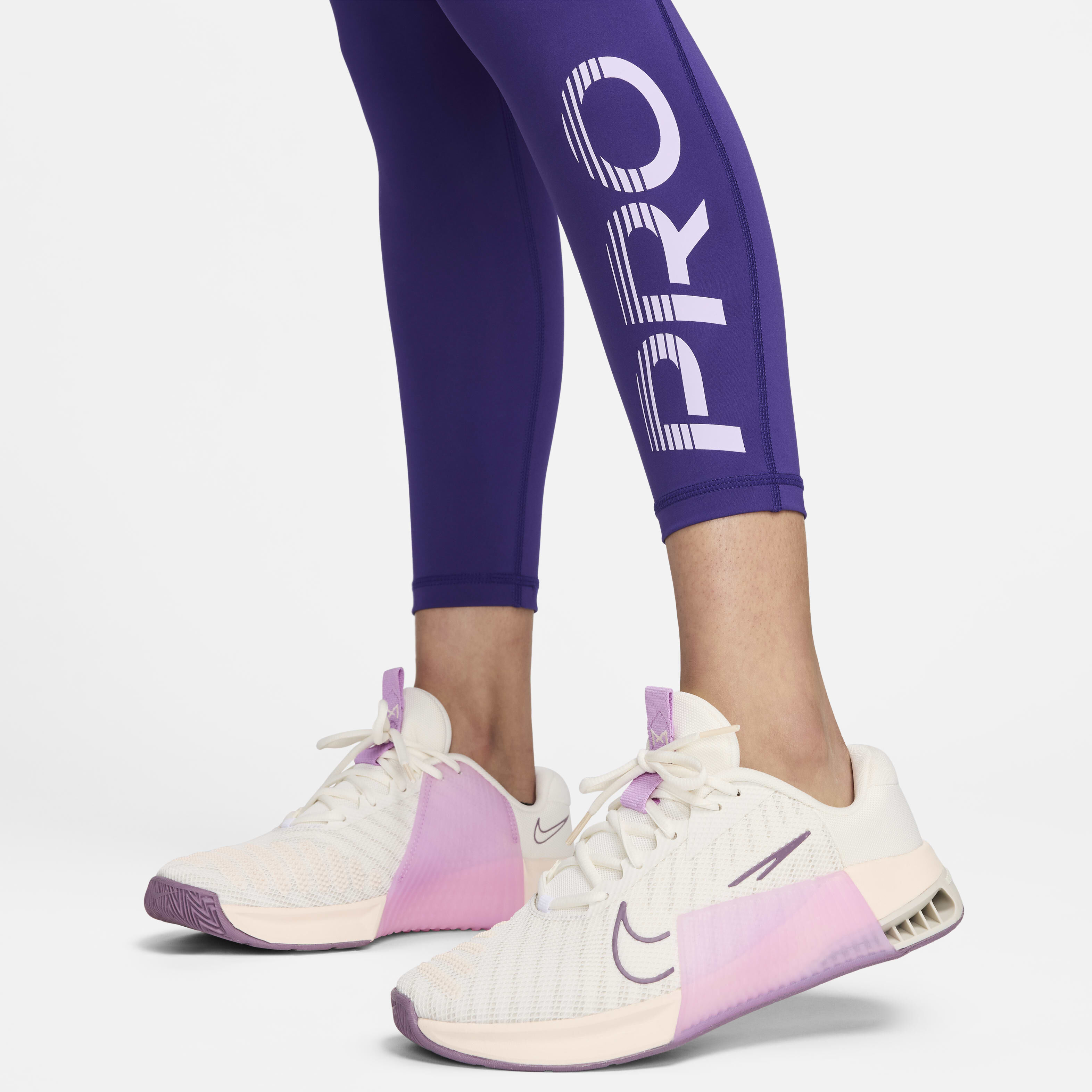Buy Nike Pro Women s Mid Rise 7 8 Graphic Leggings Court Purple Lilac Bloom White Nike Kuwait Official