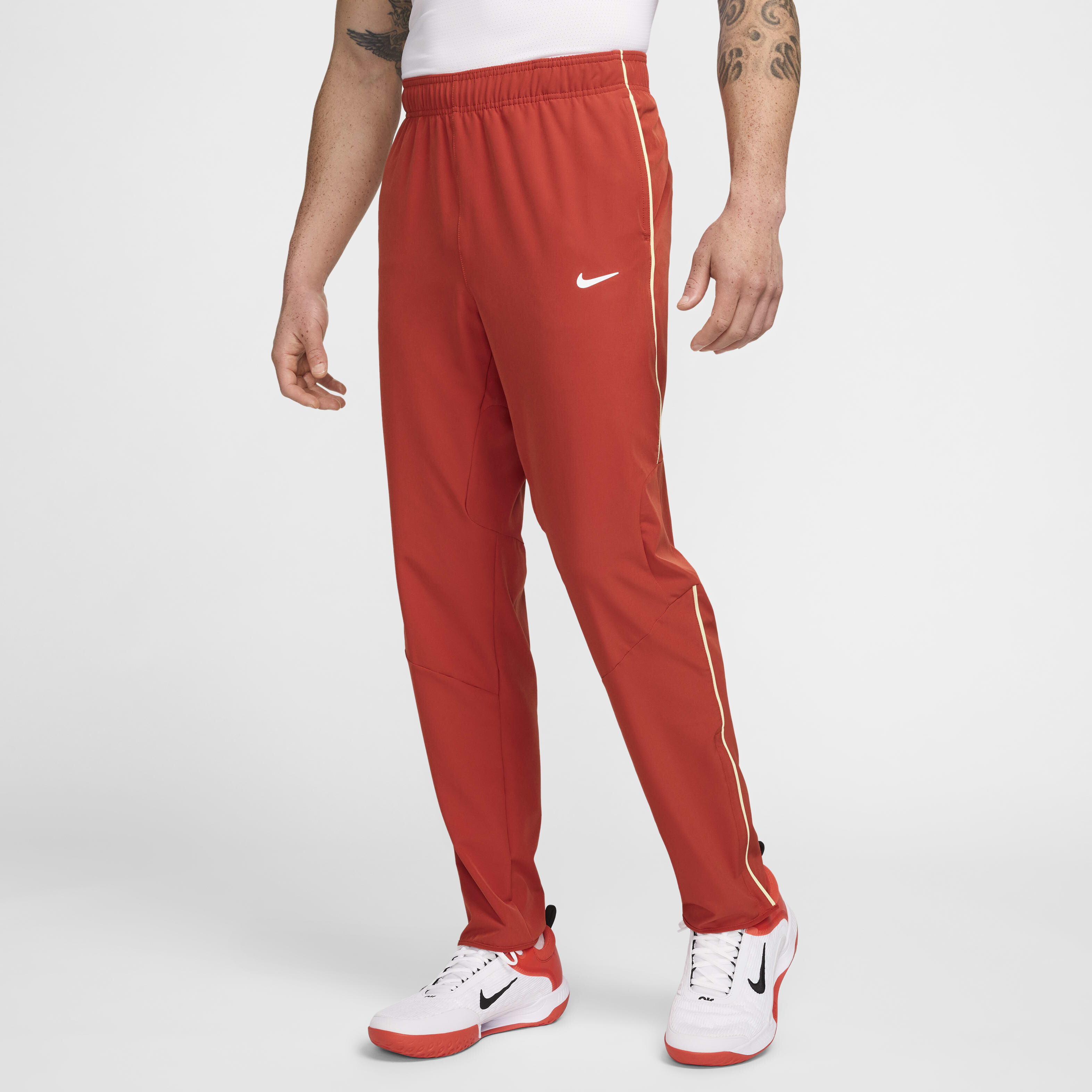 red nike trousers