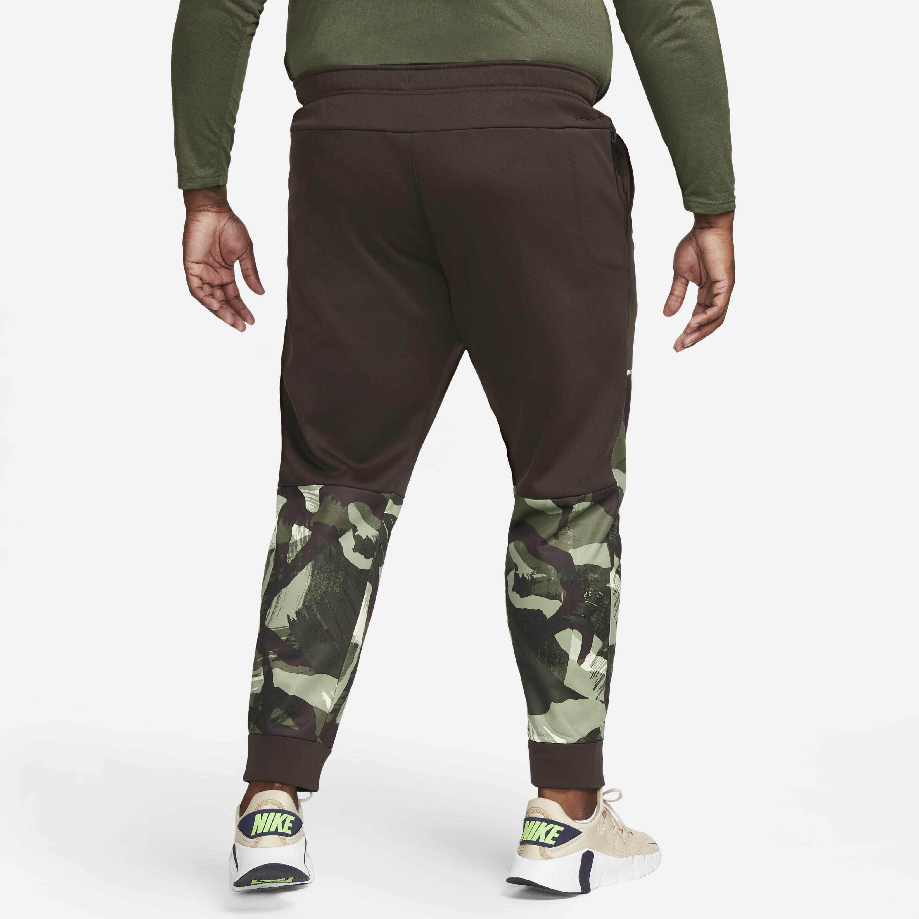 Buy Nike Therma FIT Men s Camo Tapered Training Trousers Velvet Brown Coconut Milk Nike Kuwait Official