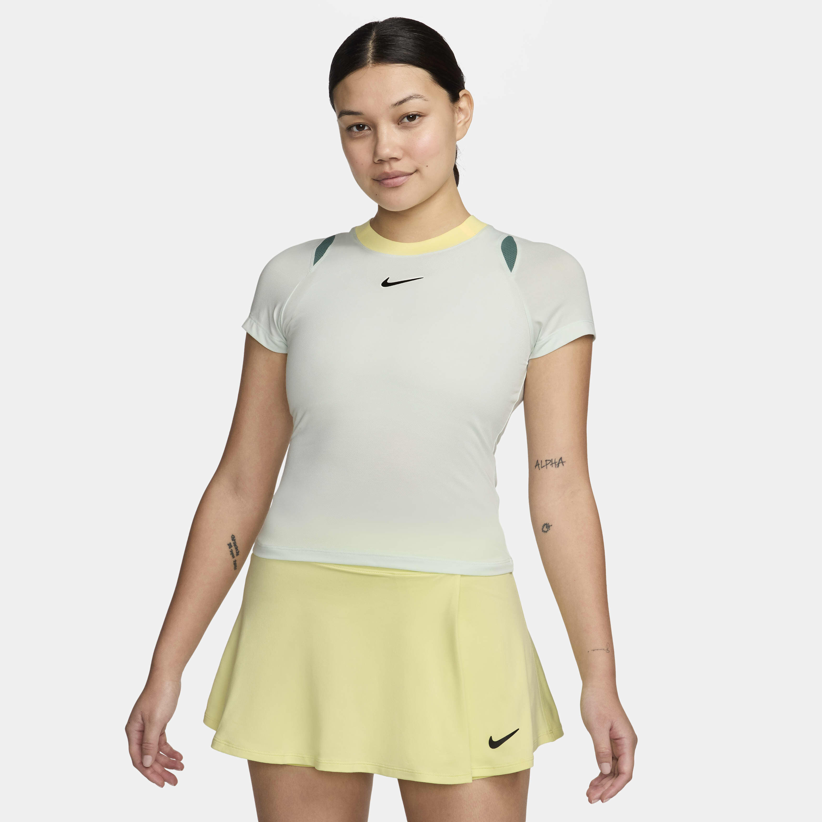 Buy NikeCourt Advantage Women s Dri FIT Short Sleeve Tennis Top Barely Green Barely Green Bicoastal Black Nike Kuwait Official
