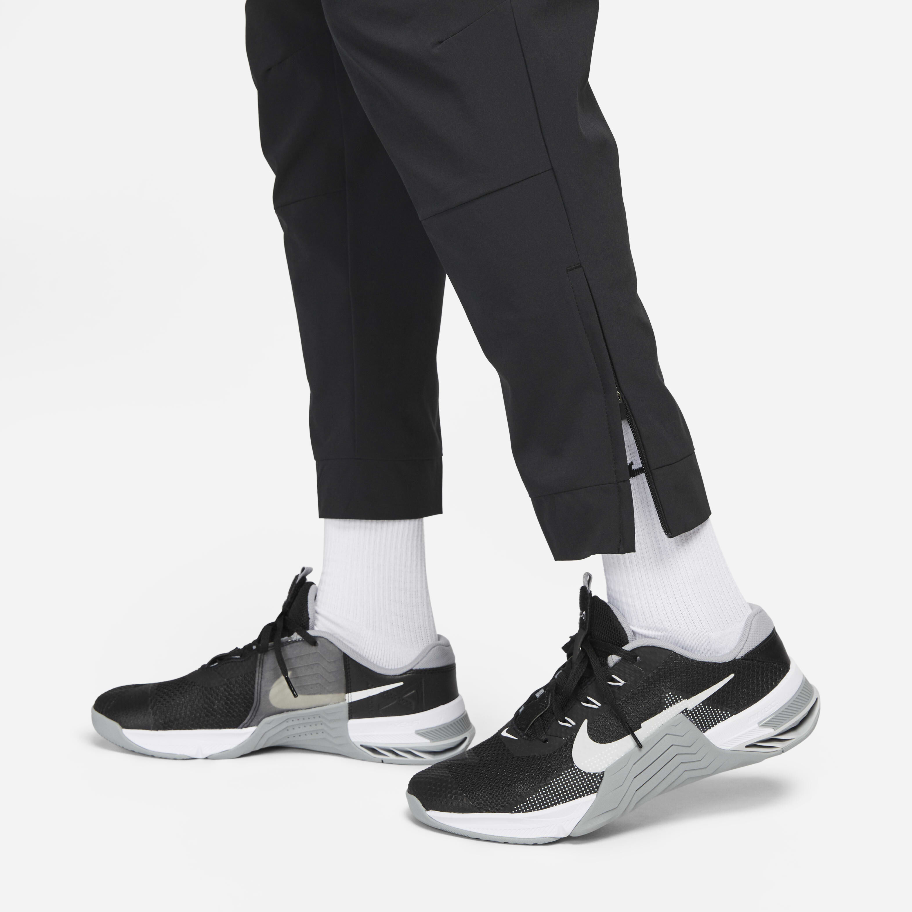 Buy Nike Unlimited Men s Dri FIT Zip Cuff Versatile Trousers Nike Kuwait Official