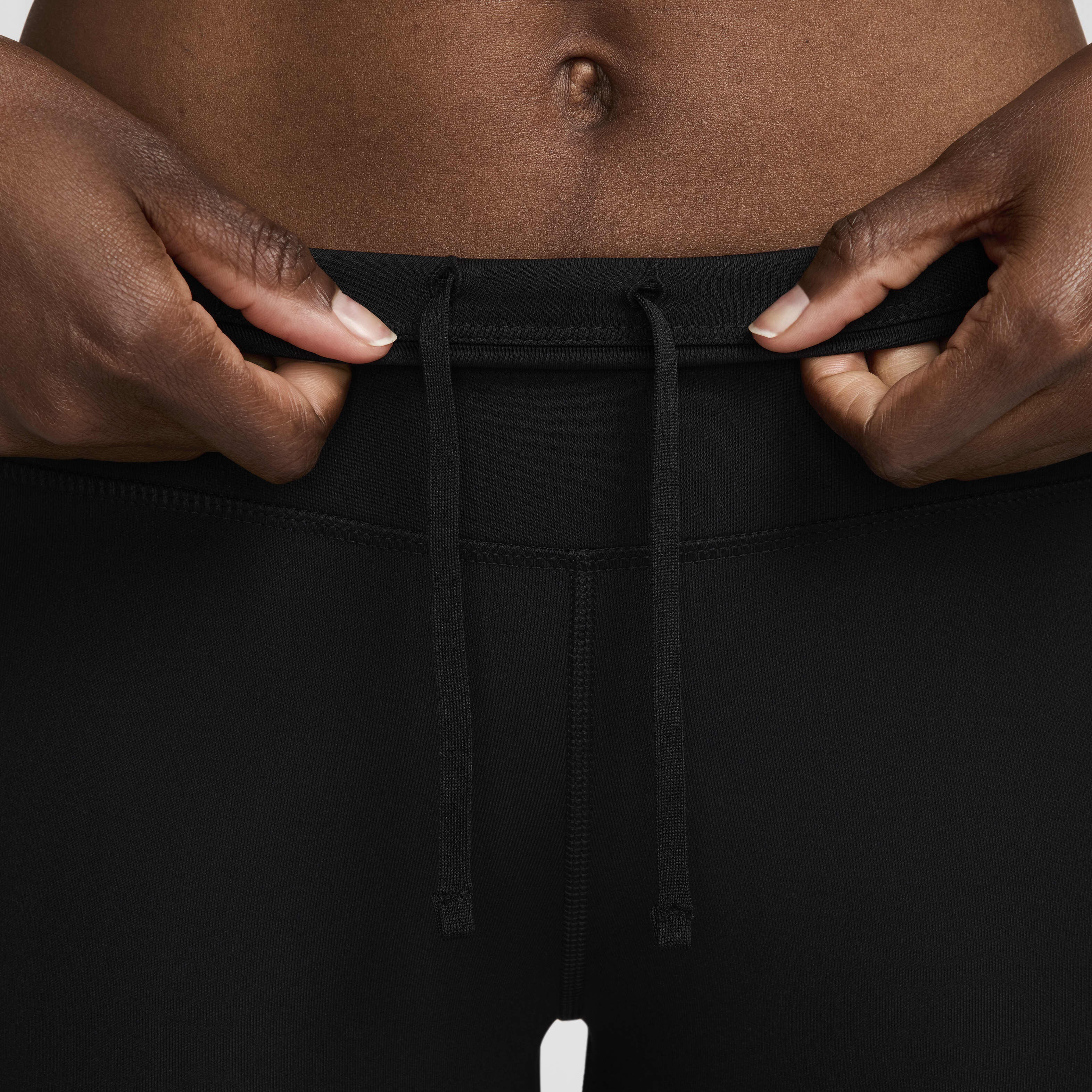 Buy Nike Fast Women s Mid Rise 7 8 Running Leggings with Pockets Black White Nike Kuwait Official