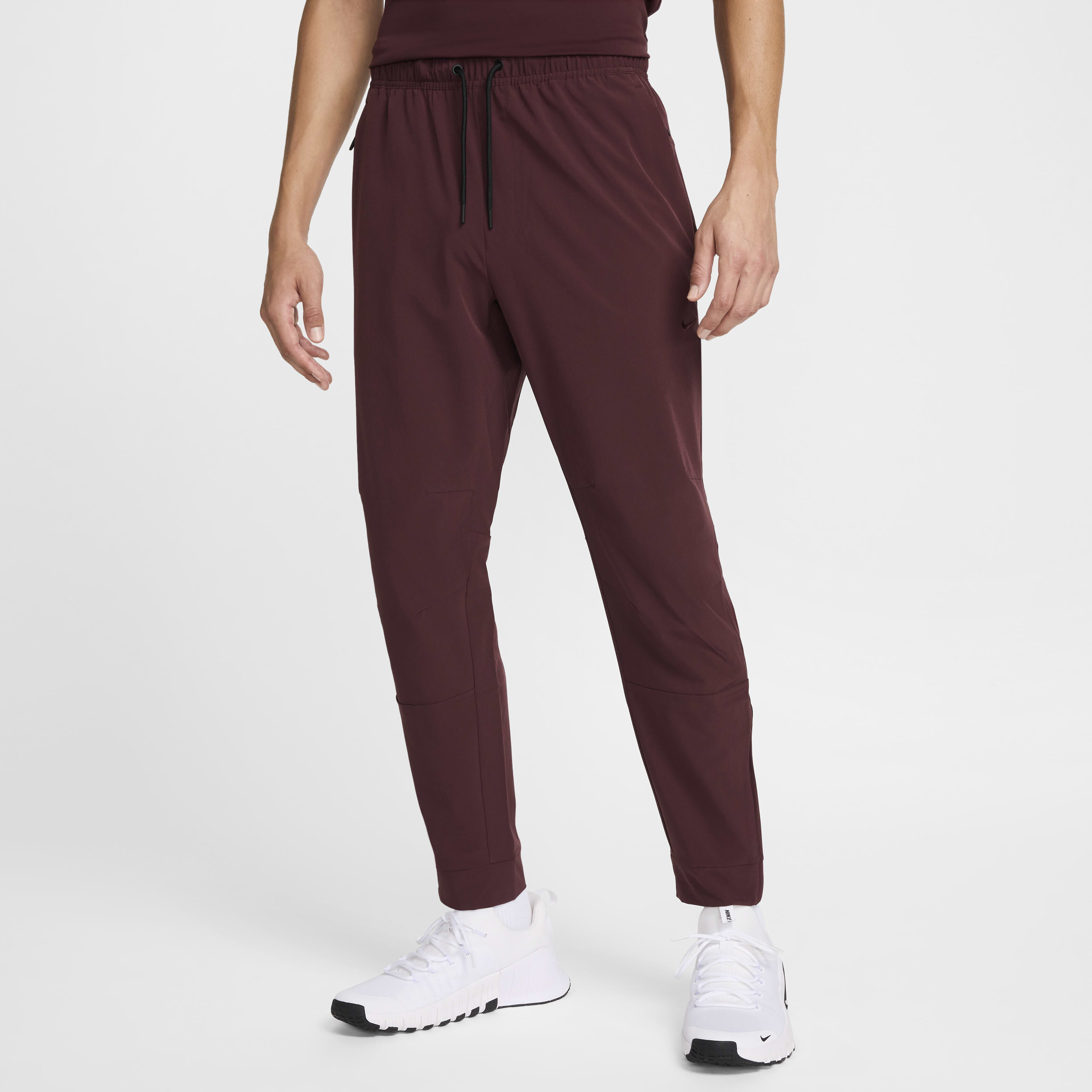 Buy Nike Unlimited Men s Dri FIT Zip Cuff Versatile Trousers Nike Kuwait Official