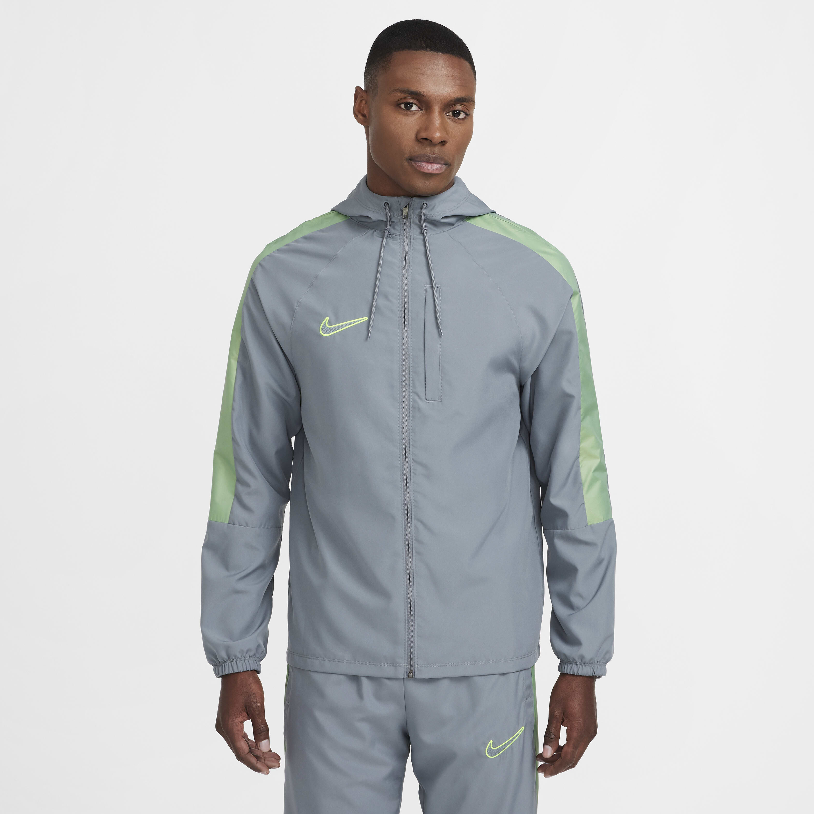 Buy Nike Academy Men s Water Repellent Hooded Football Jacket Cool Grey Cool Grey Volt Volt Nike Kuwait Official
