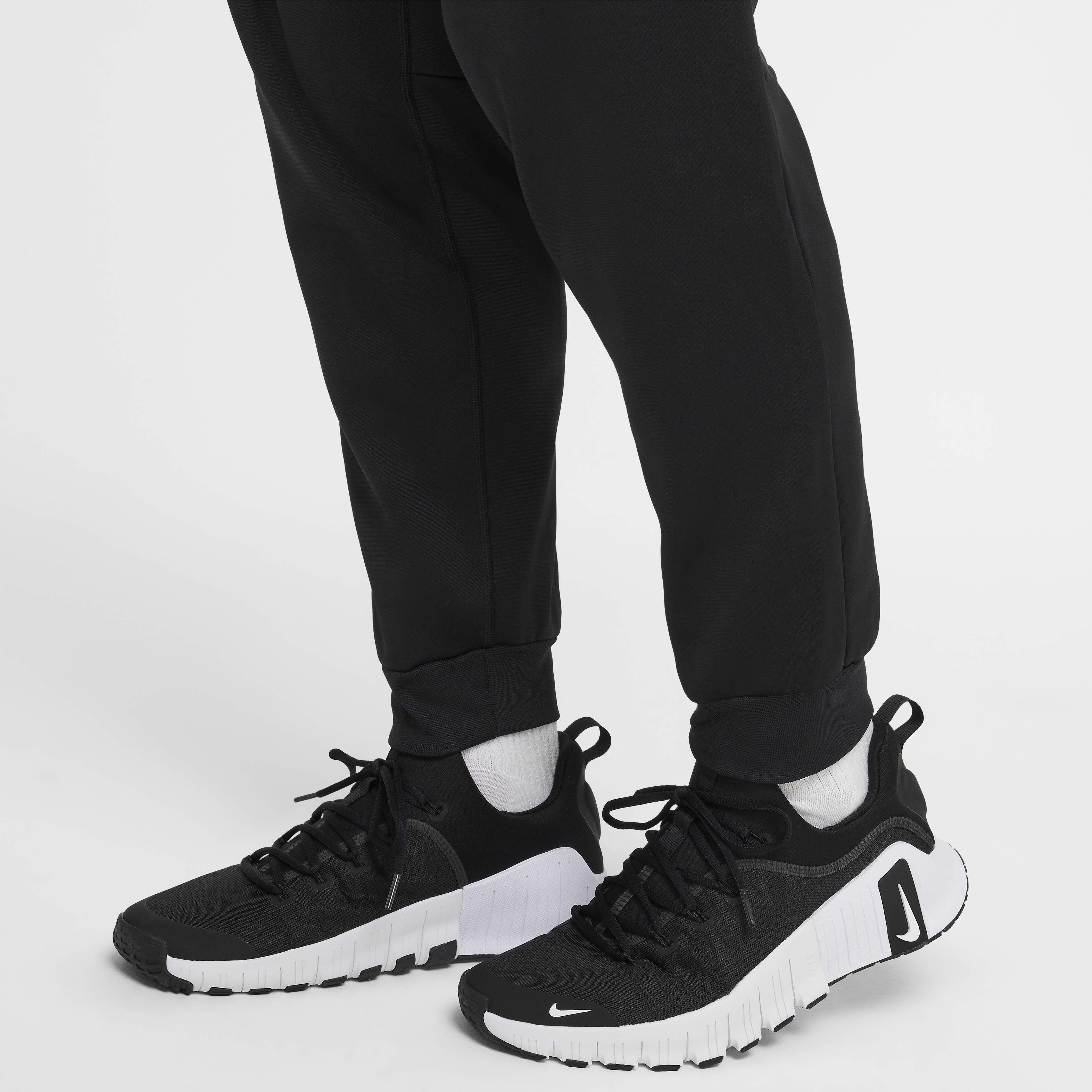 Buy Nike Men's Therma-FIT Tapered Fitness Trousers - Black Buy Nike Men's Therma-FIT Tapered Fitness Trousers - Black