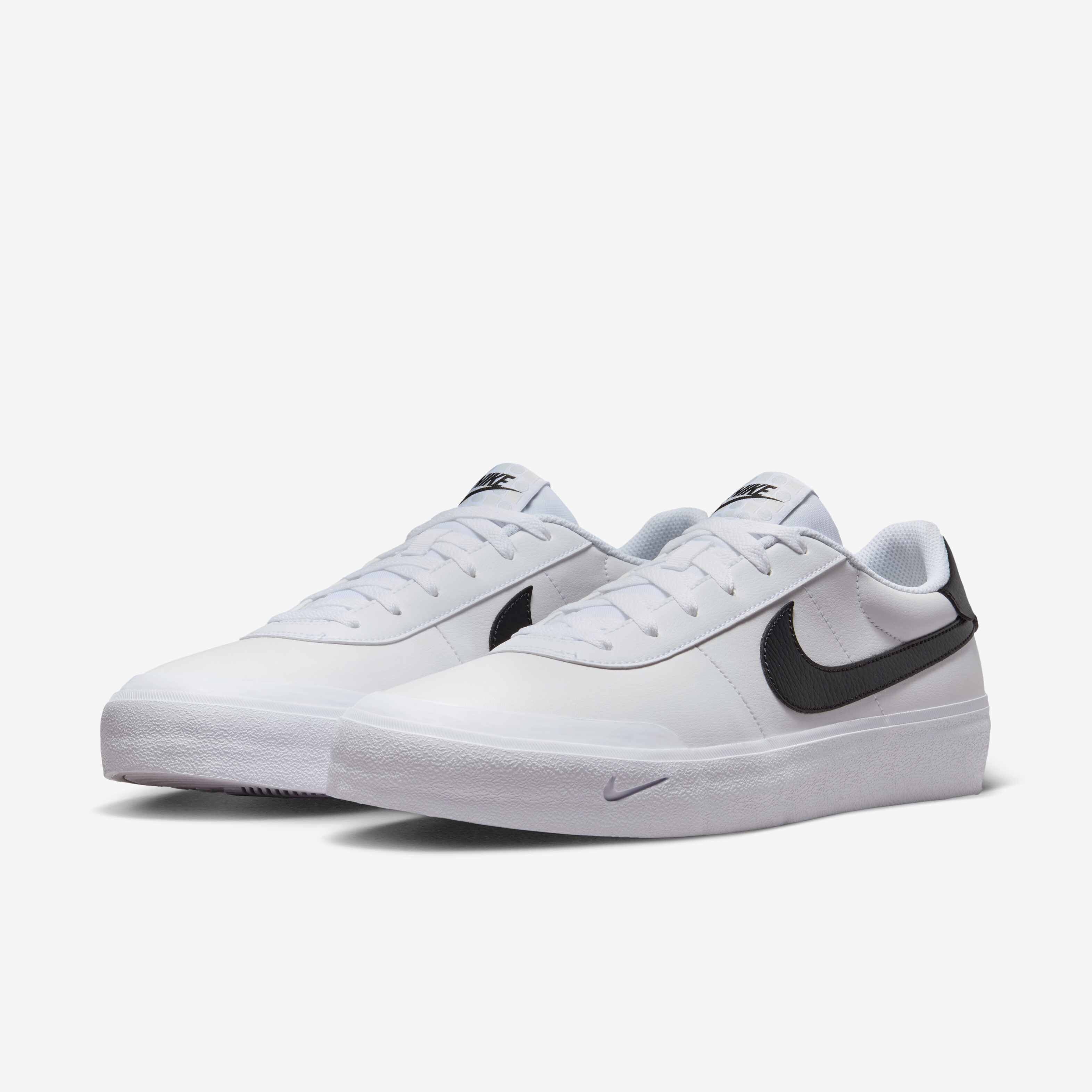 white nike tennis shoes with black swoosh